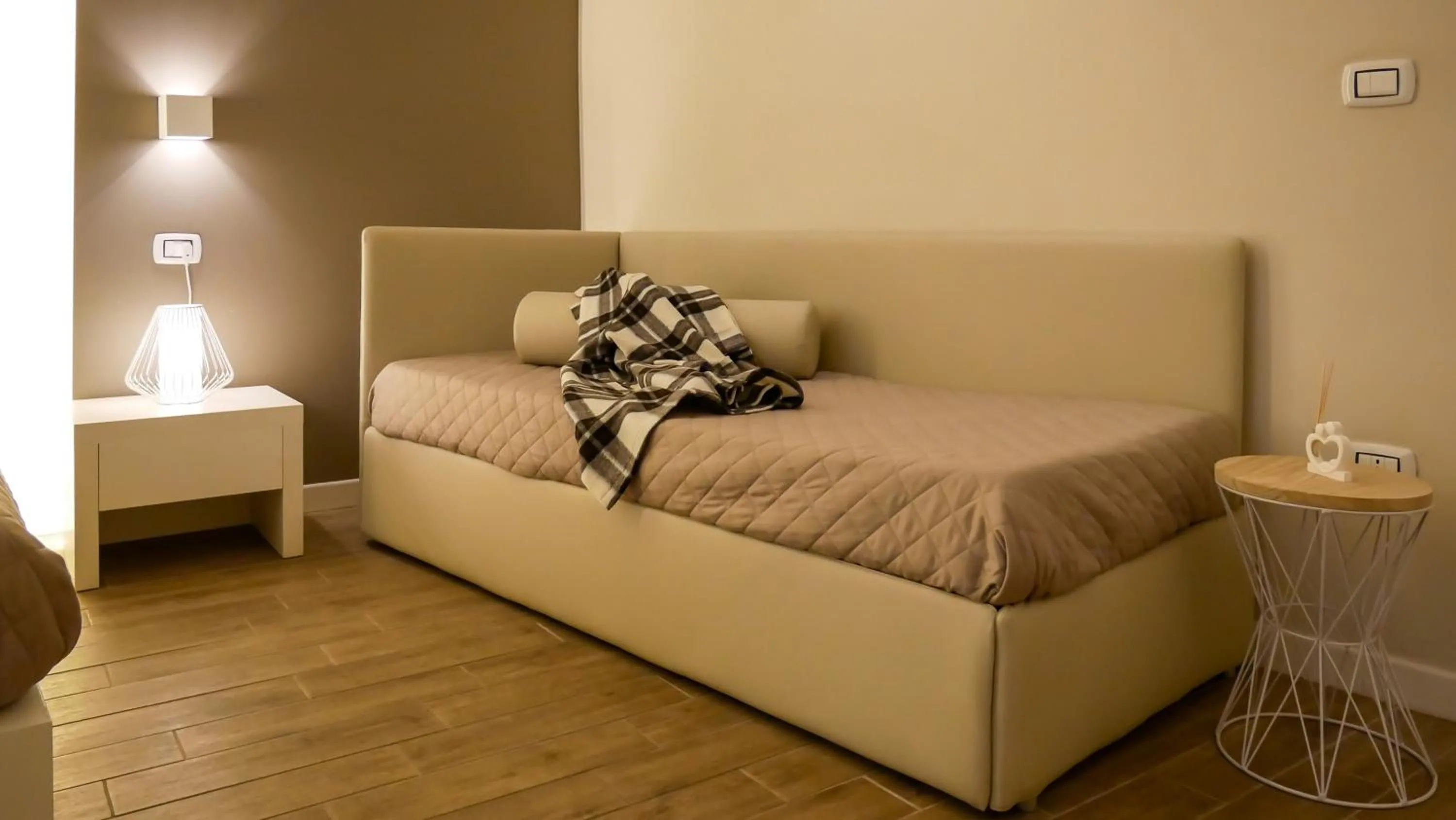 Bed in La Banchina Holiday Rooms