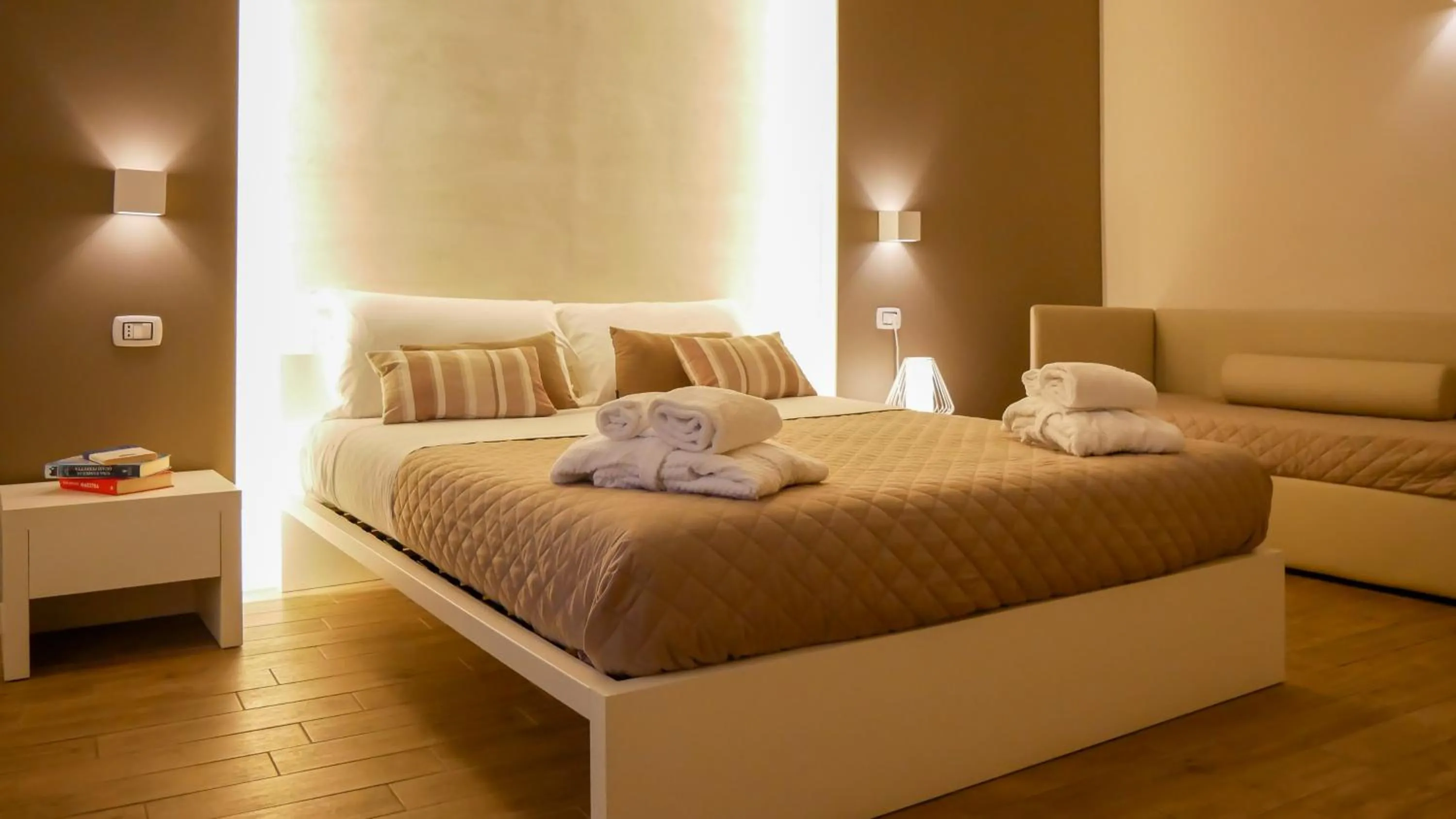Bed in La Banchina Holiday Rooms