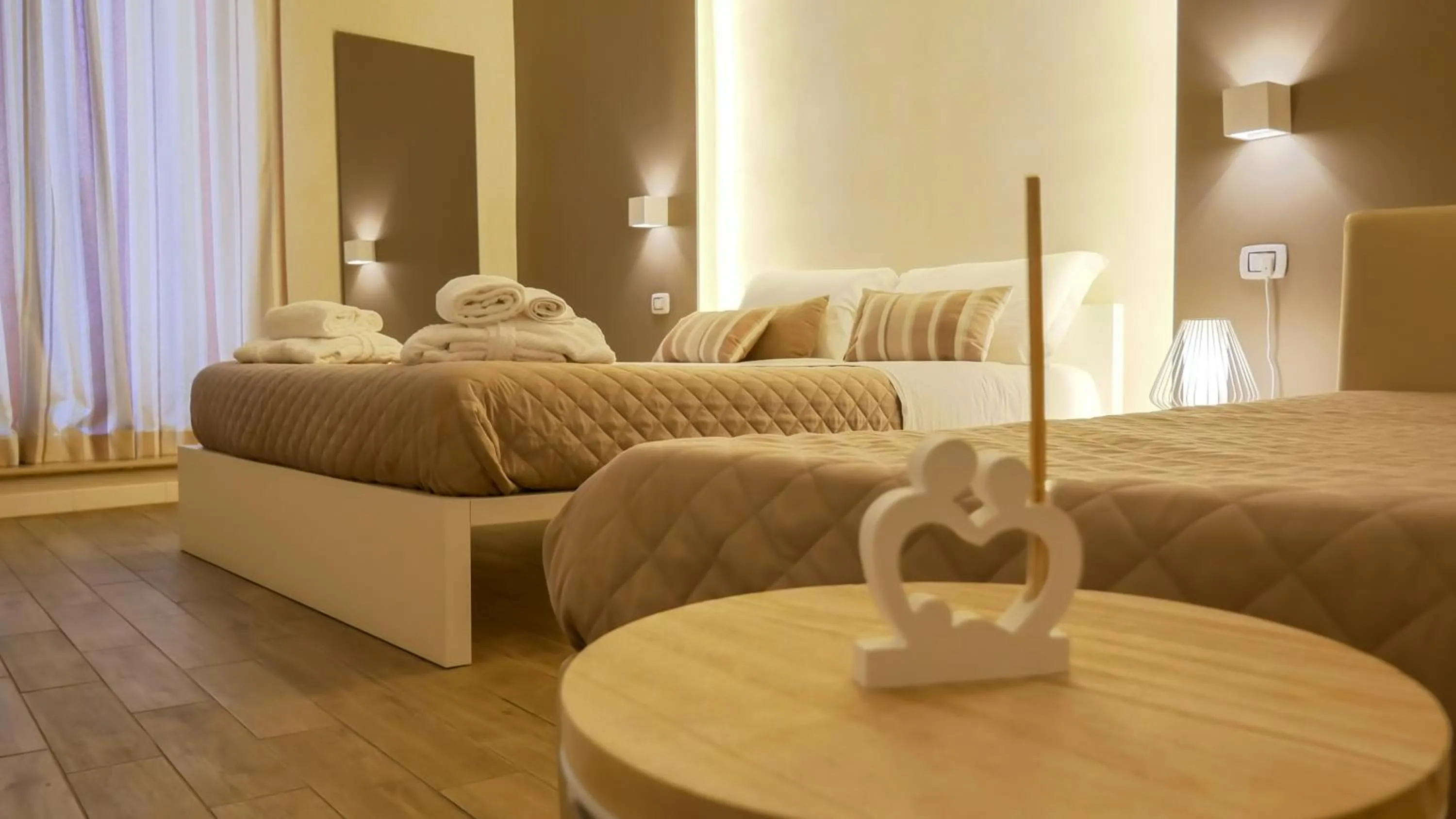 Bed in La Banchina Holiday Rooms