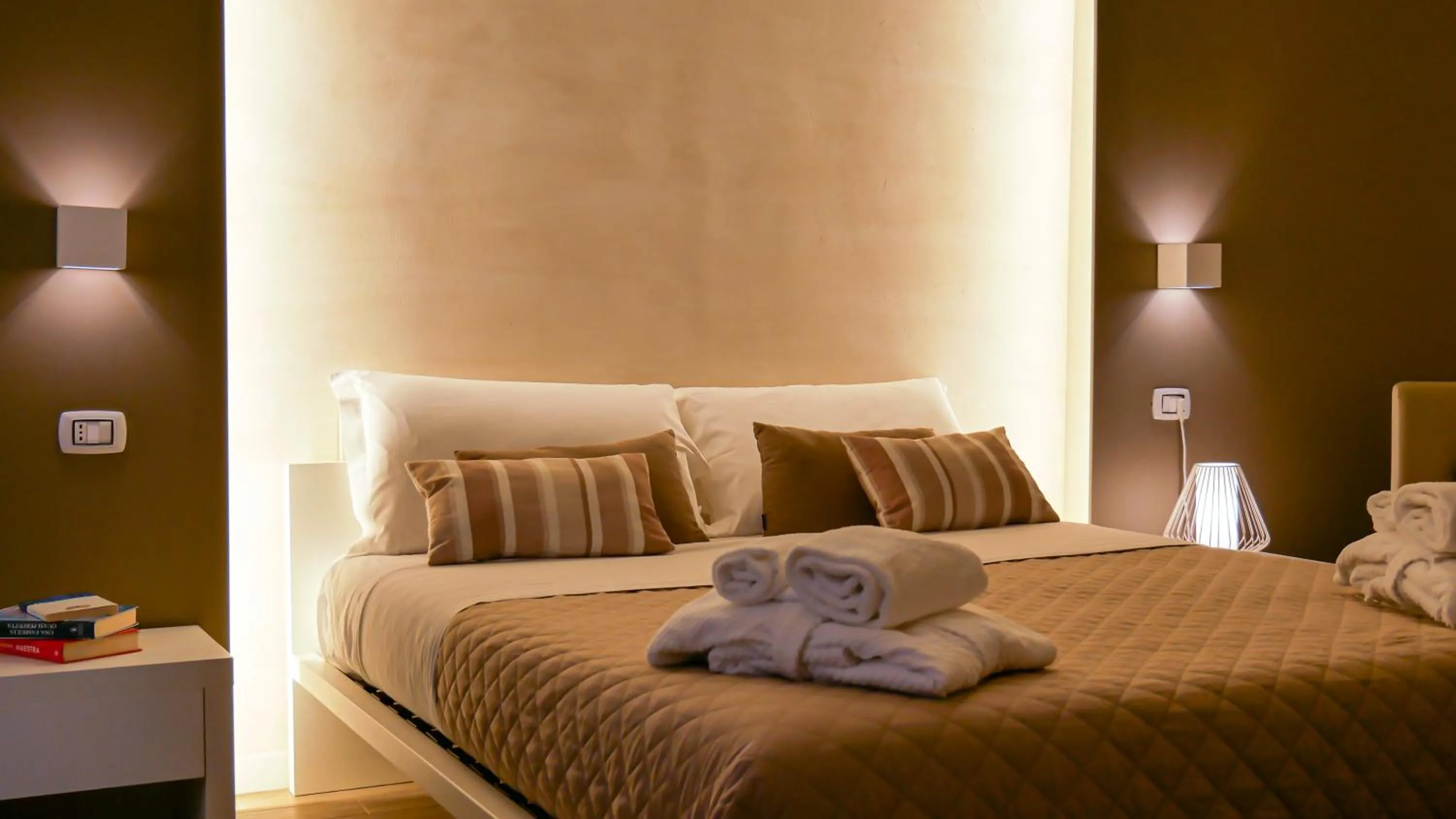 Bed in La Banchina Holiday Rooms