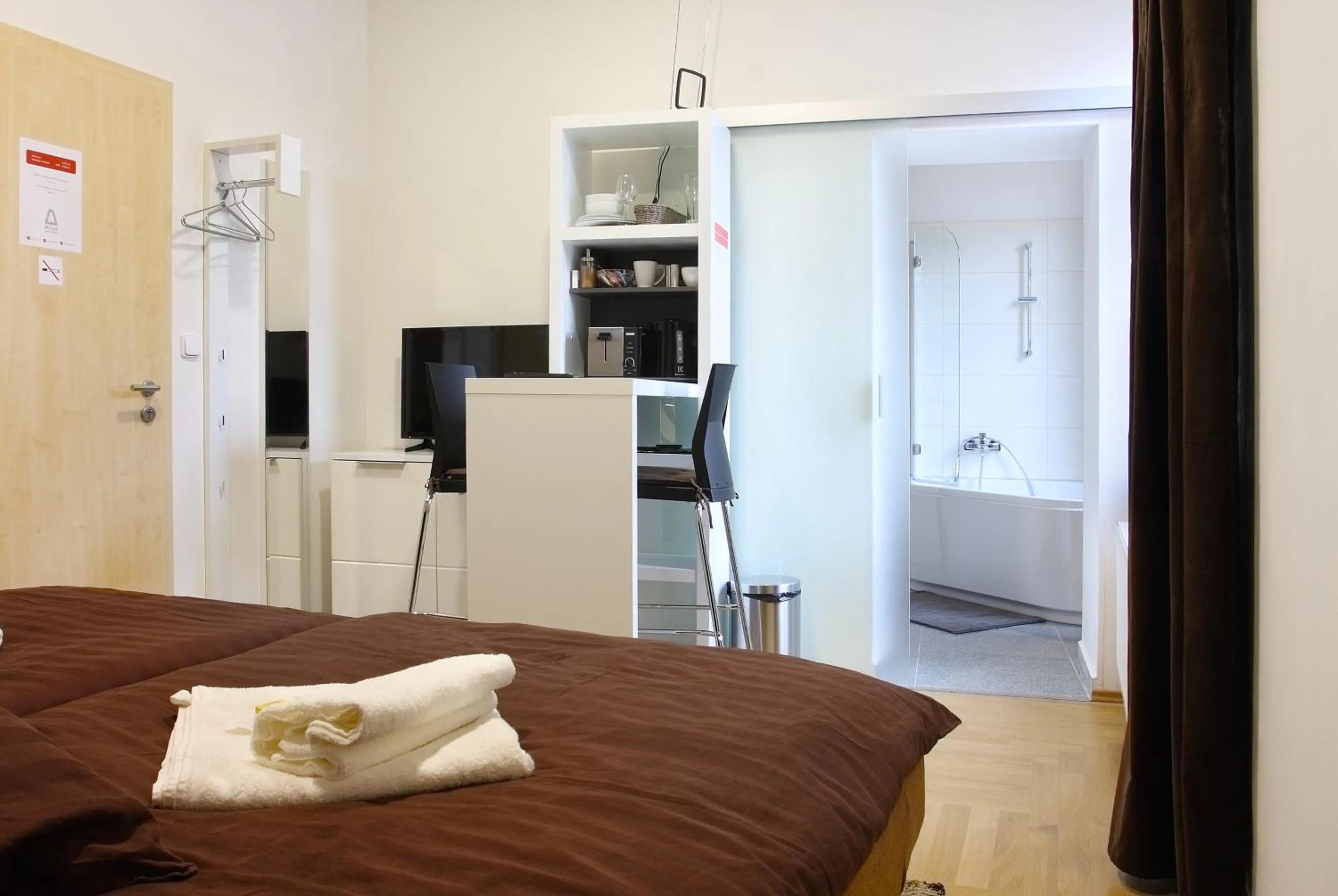 Bed in Atrium Apartments