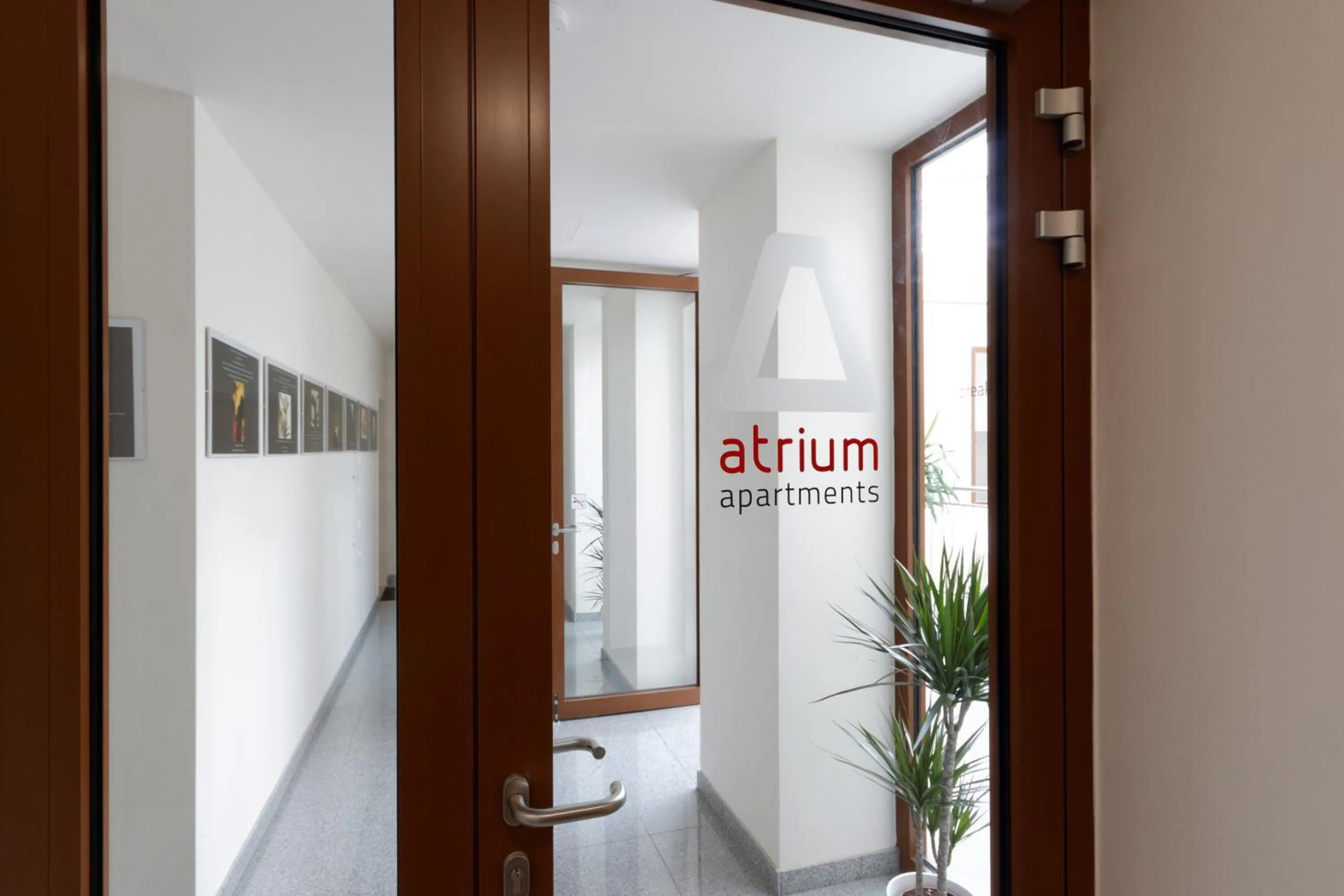 Property logo or sign in Atrium Apartments