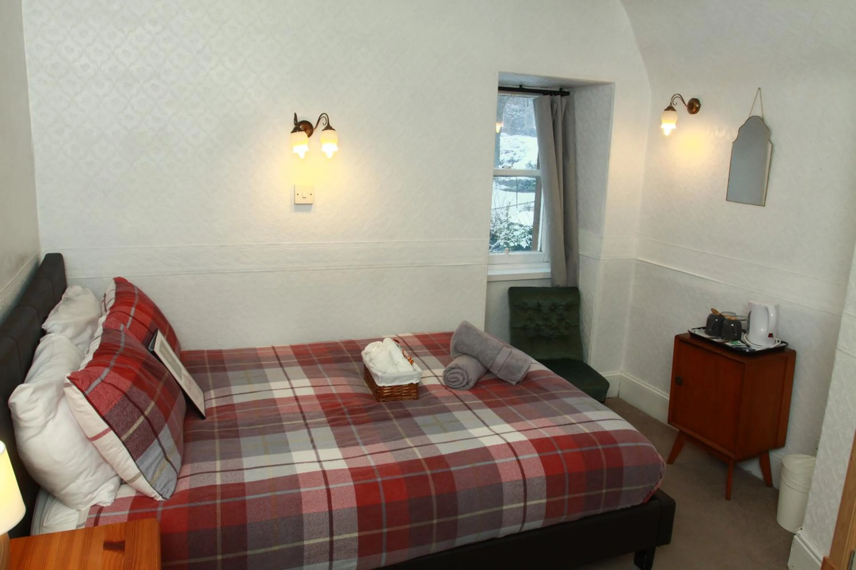 Bed in The Retreat Hotel