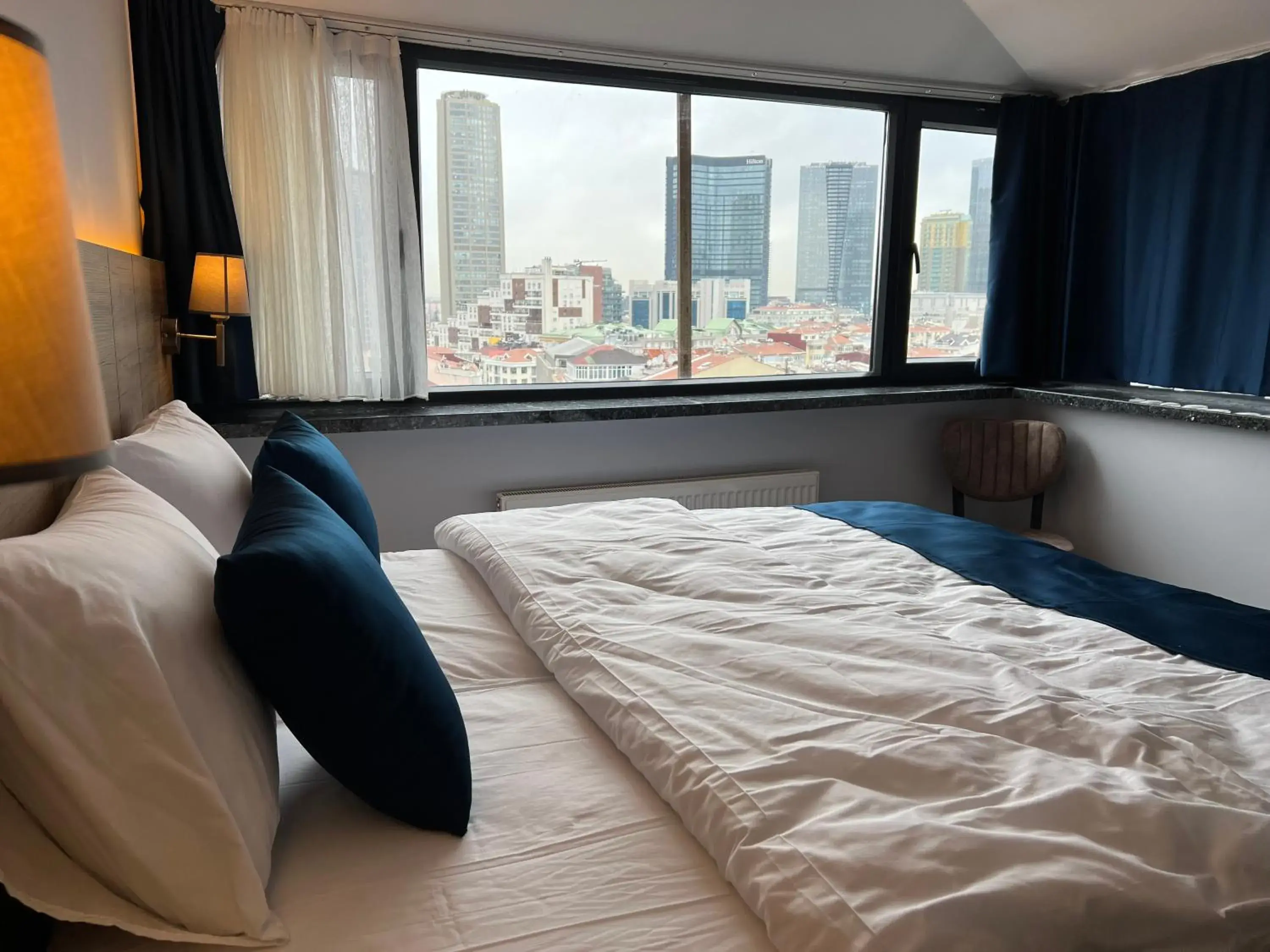 Bed in The Blue Suites Bed in The Blue Suites