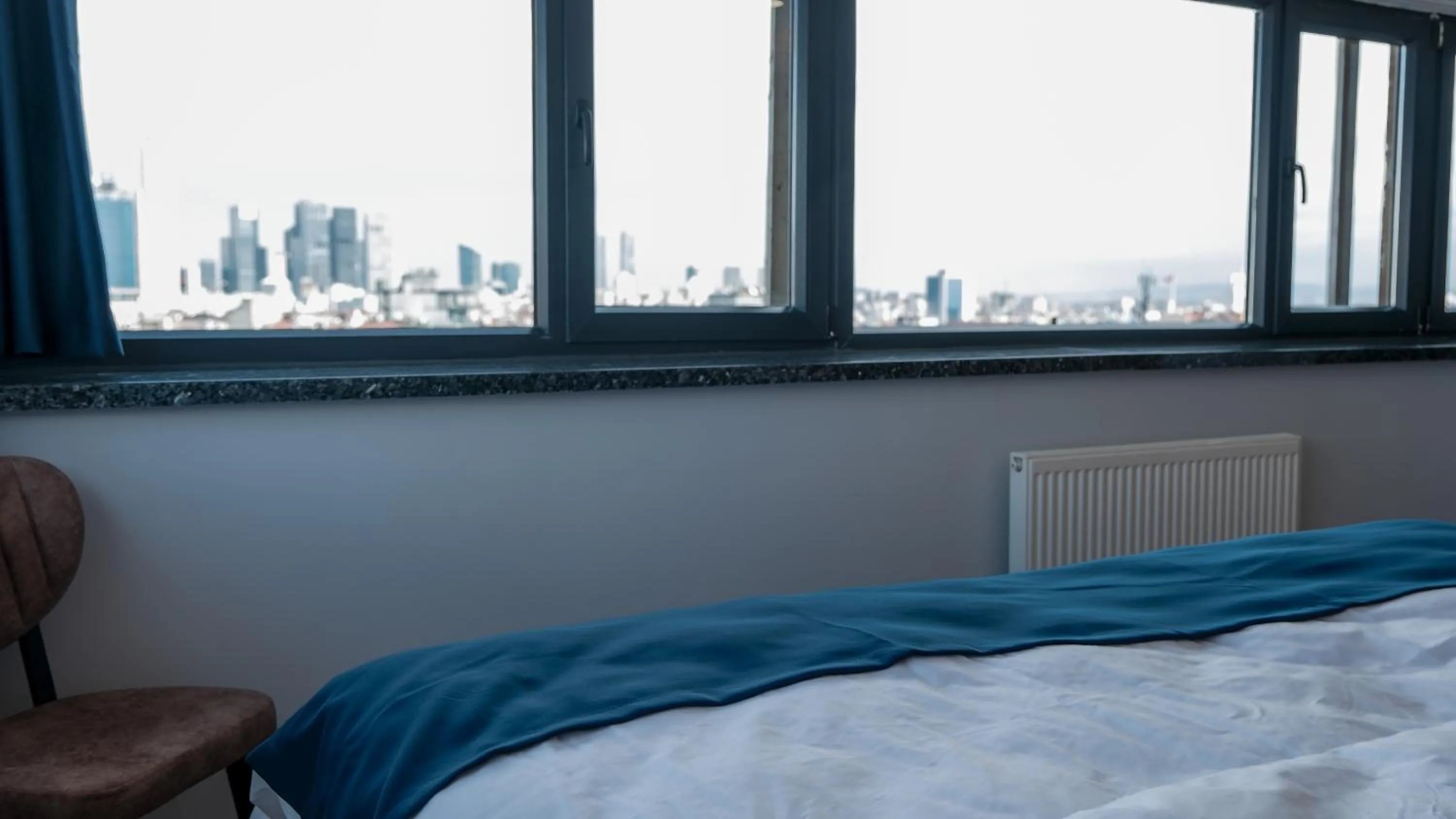 City view, Bed in The Blue Suites