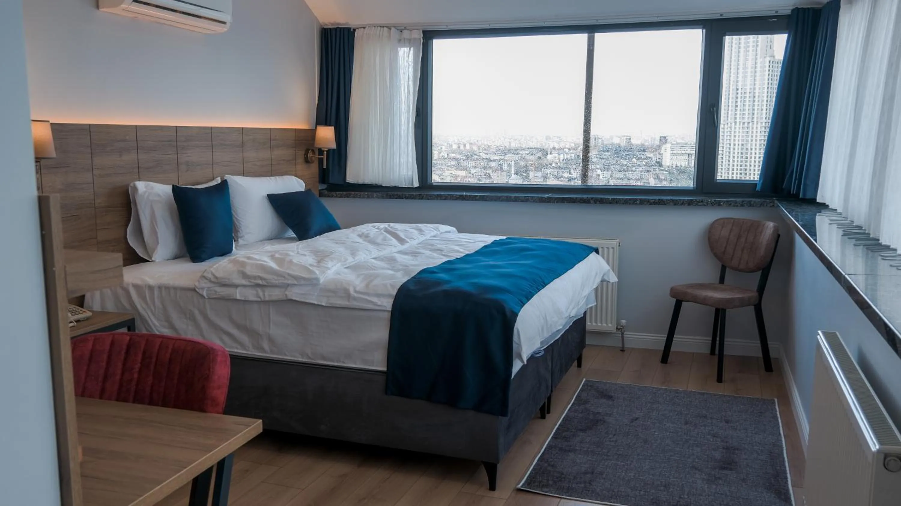 Photo of the whole room, Bed in The Blue Suites