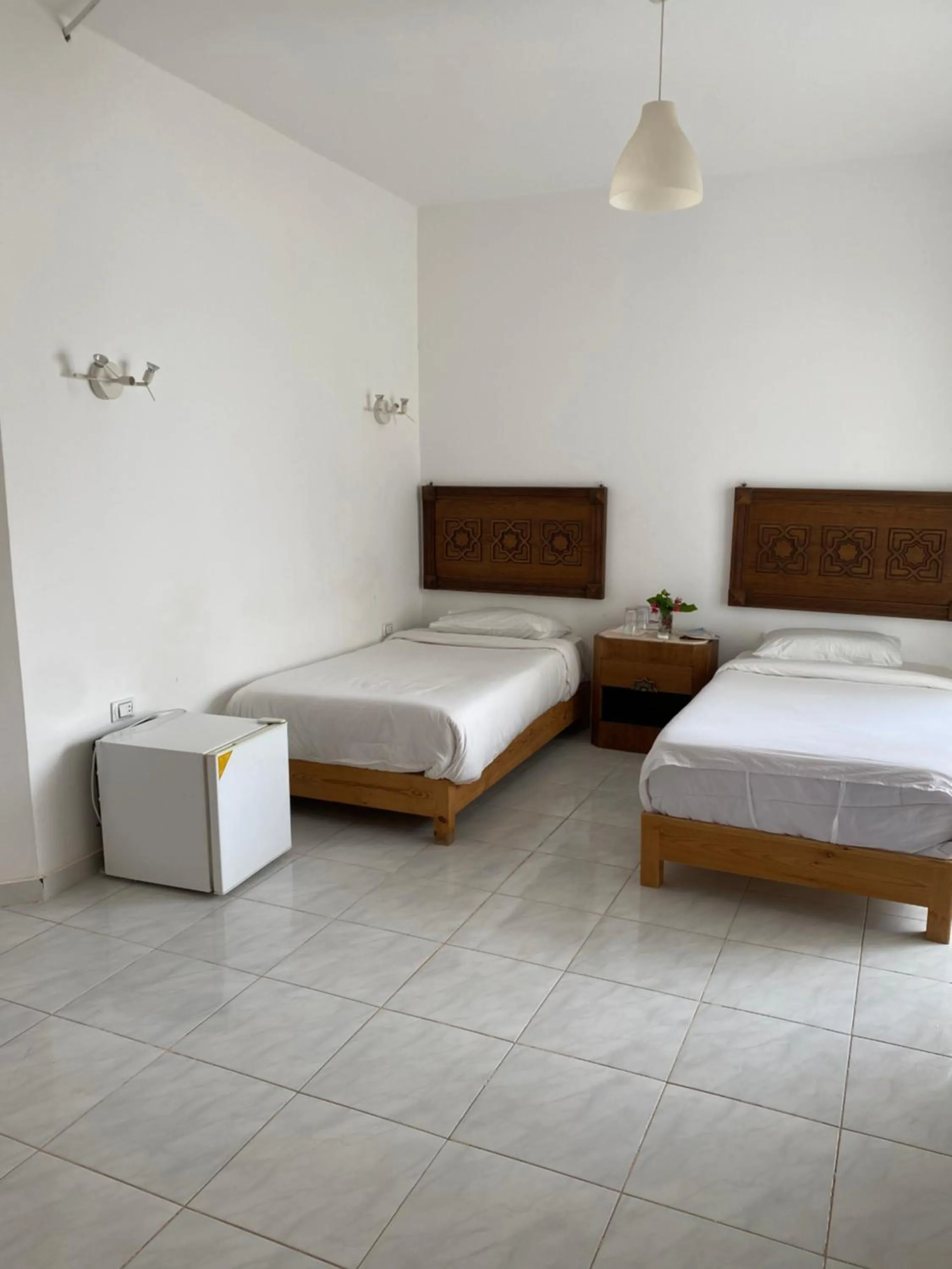 Bed in Blue Vision Diving Hotel