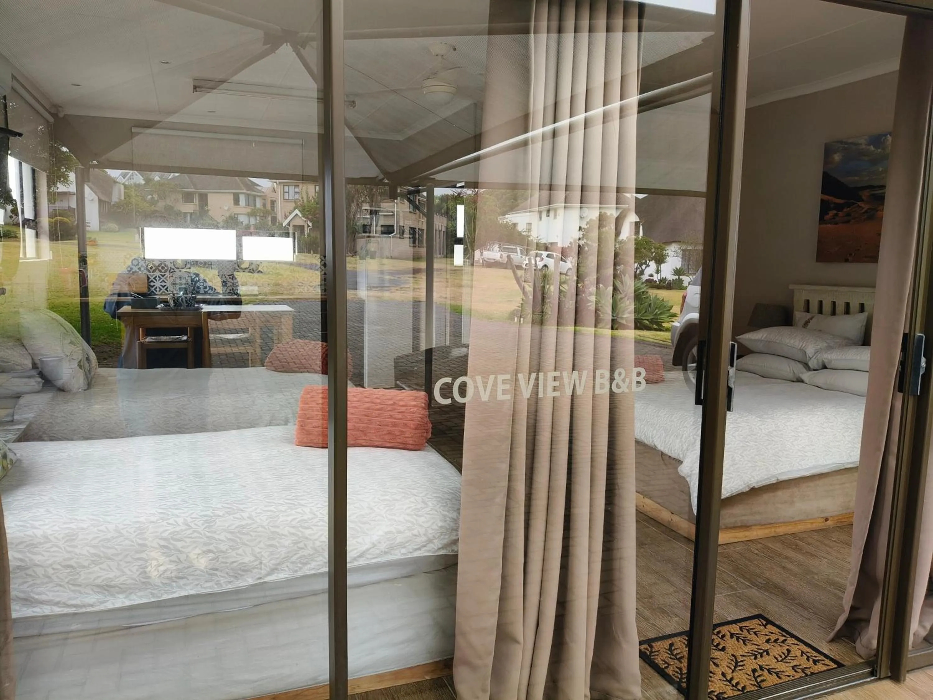 Property building, Bed in Cove View B&B