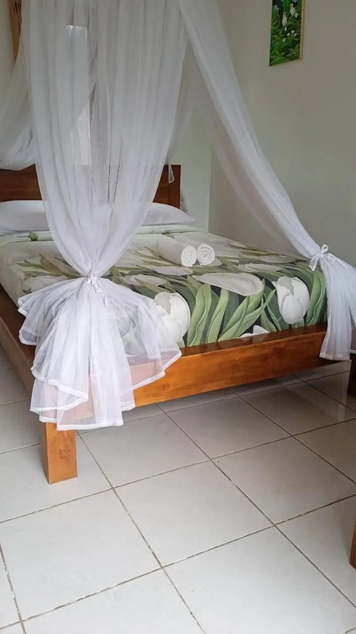 Bed in Meme Royak Homestay