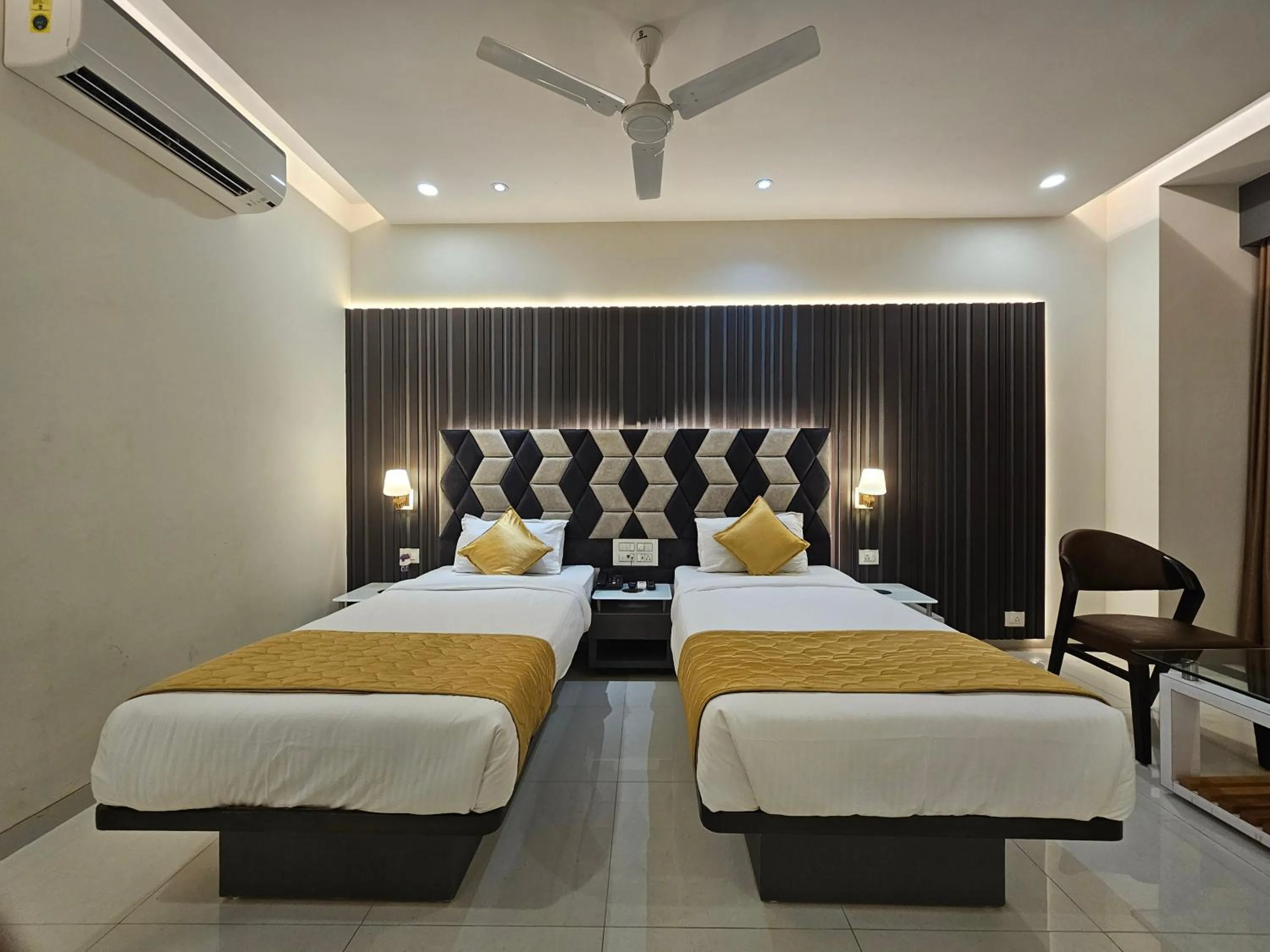 Bed in Hotel Grand Darshan Vadodara