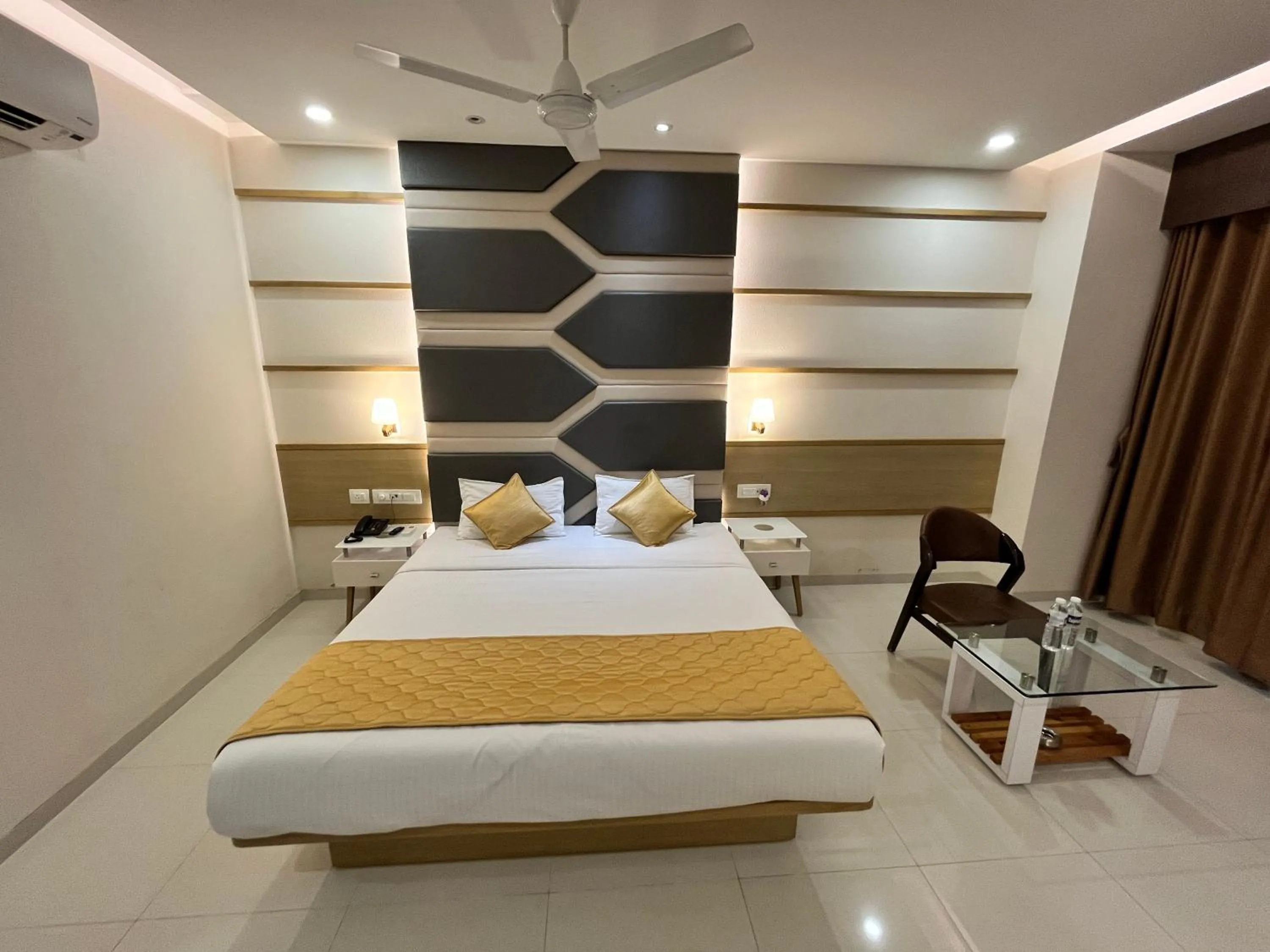Bed in Hotel Grand Darshan Vadodara