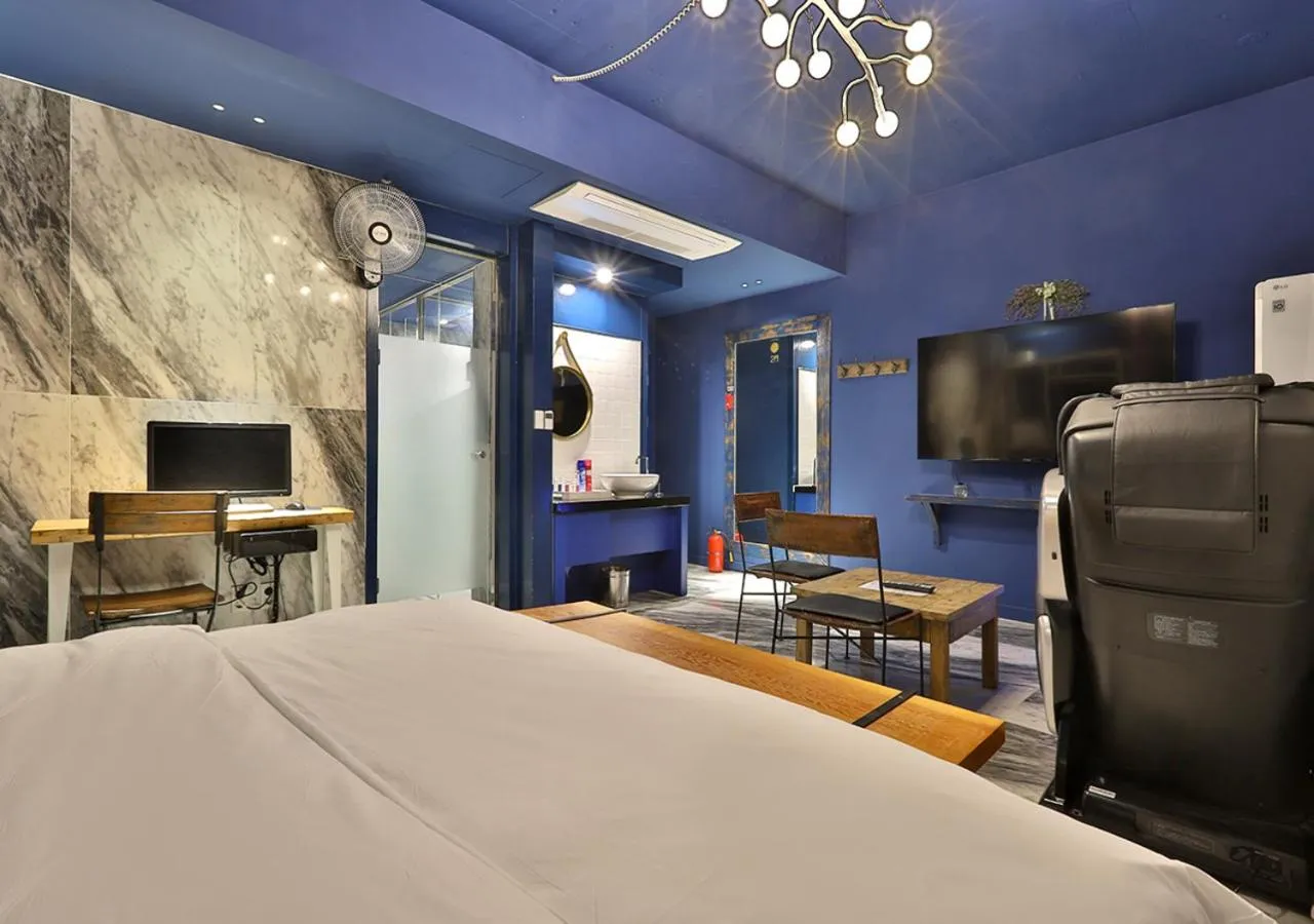 Seating area, Bed in February Hotel Gimhae