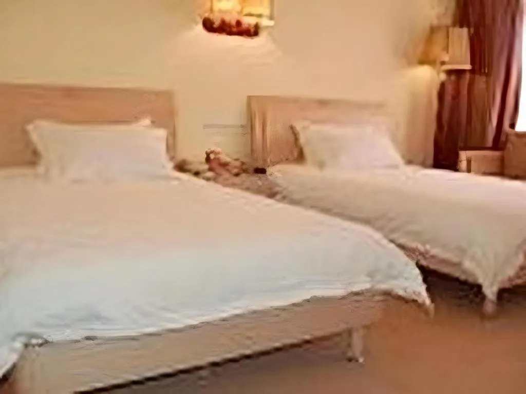 Bed in Yue Lai Yue Hotel