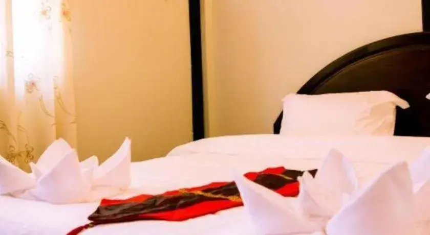 Bed in New Lao Paris Hotel Bed in New Lao Paris Hotel