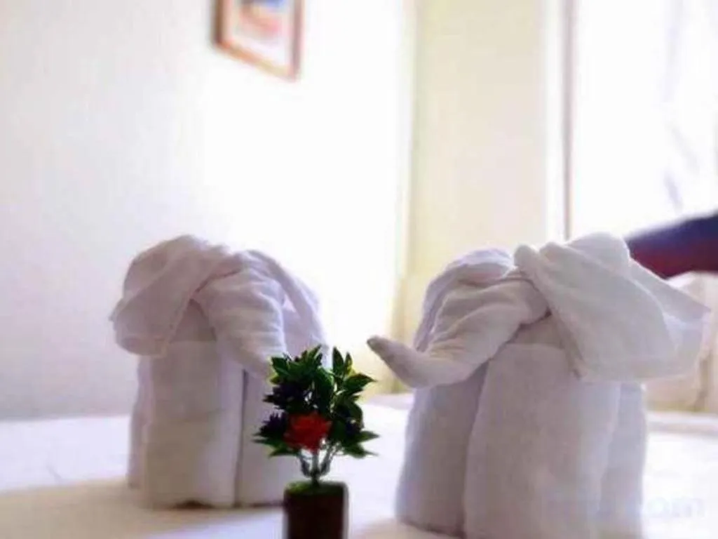 Bed in New Lao Paris Hotel