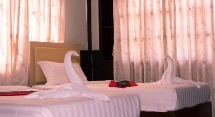 Bed in New Lao Paris Hotel