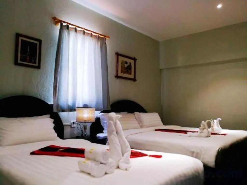 Bed in New Lao Paris Hotel