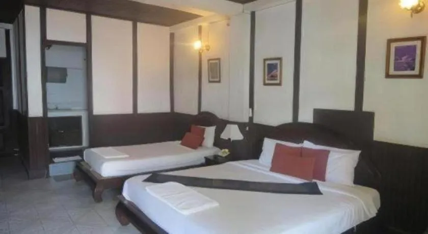 Bed in New Lao Paris Hotel