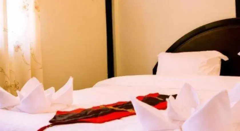 Bed in New Lao Paris Hotel Bed in New Lao Paris Hotel