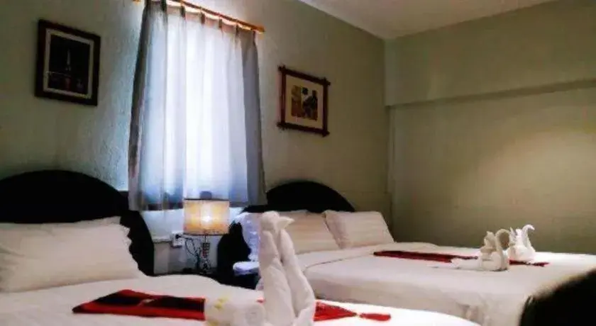 Bed in New Lao Paris Hotel Bed in New Lao Paris Hotel