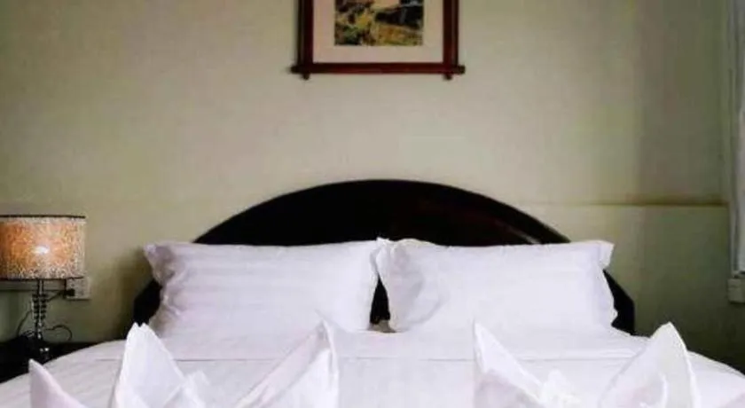 Bed in New Lao Paris Hotel