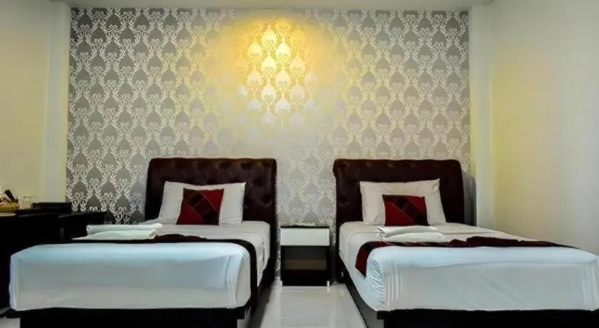 Bed in Nan Treasure Hotel