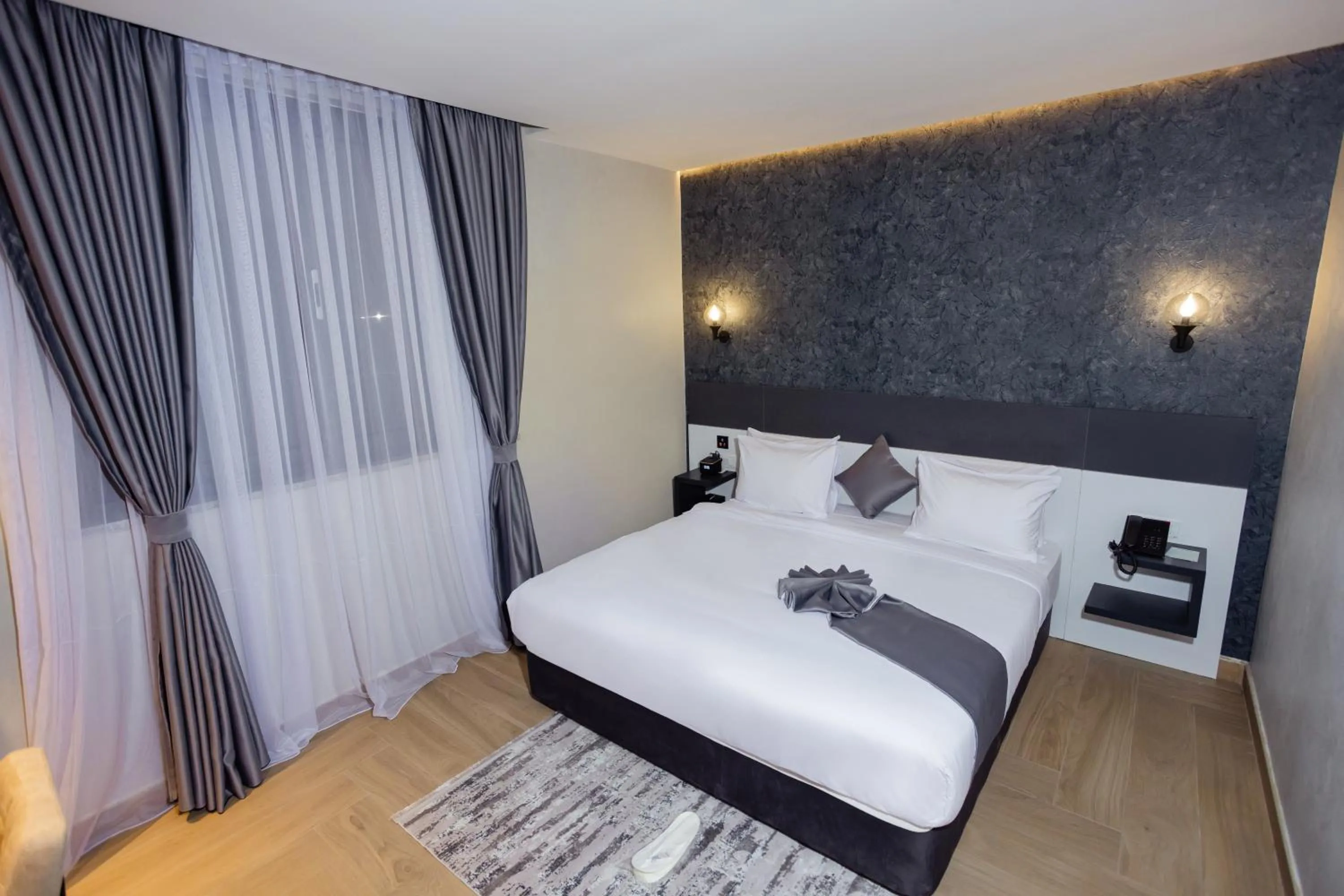 Bed in Shitaye Suite Hotel