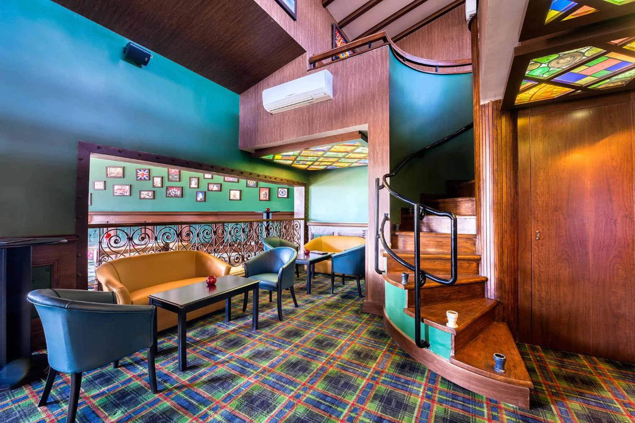 Communal lounge/ TV room in The Olive Tree Hotel