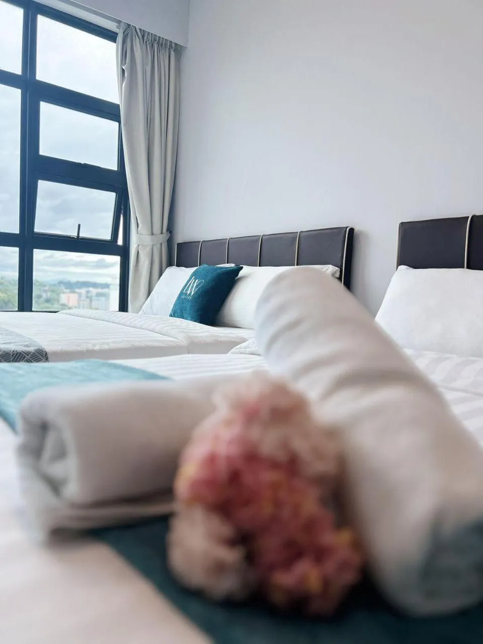 Bed in Jesselton Quay Kota Kinabalu City Centre by LW Suites