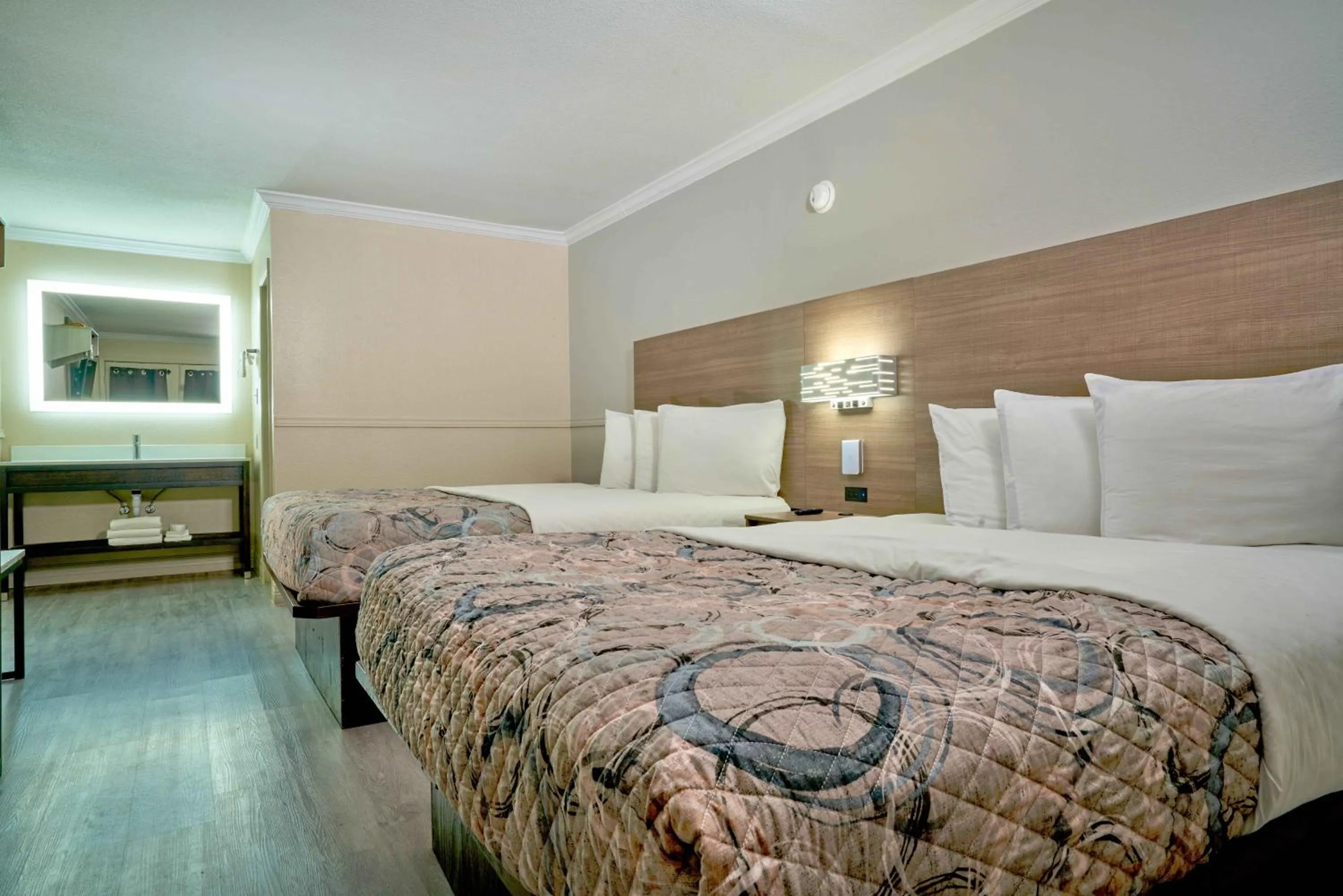 Bed in Family Garden Inn & Suites