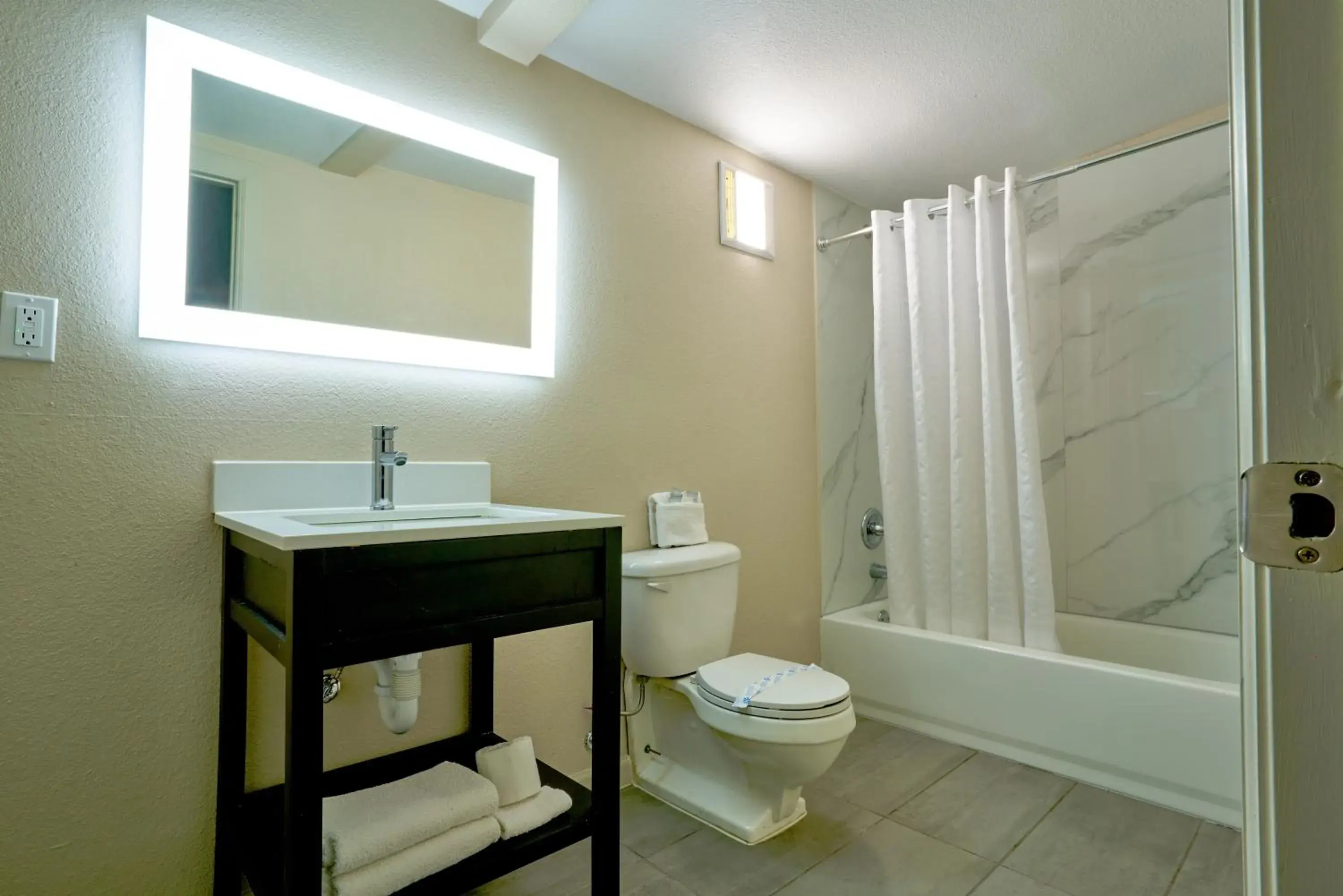 Bathroom in Family Garden Inn & Suites Bathroom in Family Garden Inn & Suites