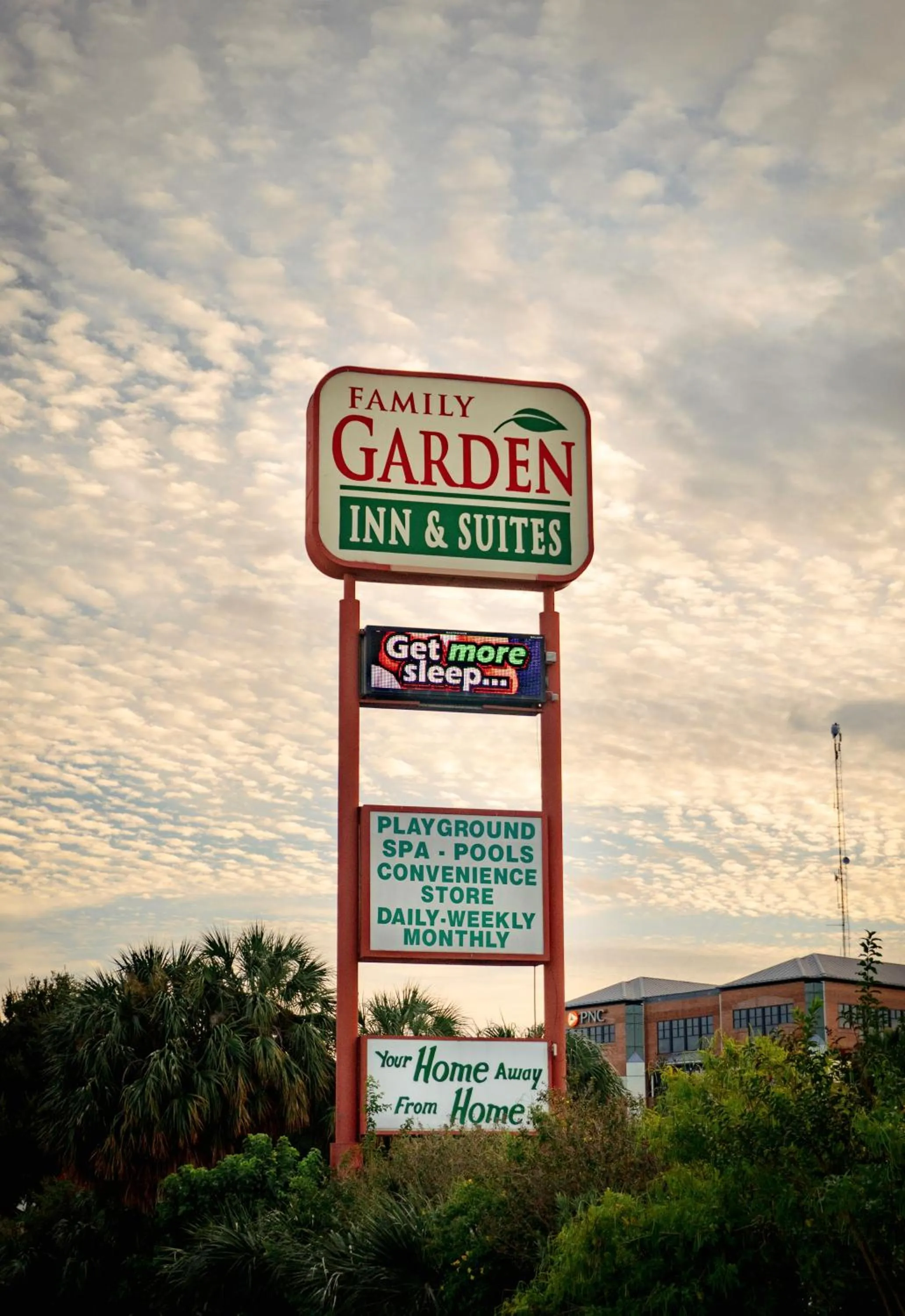 Property logo or sign in Family Garden Inn & Suites