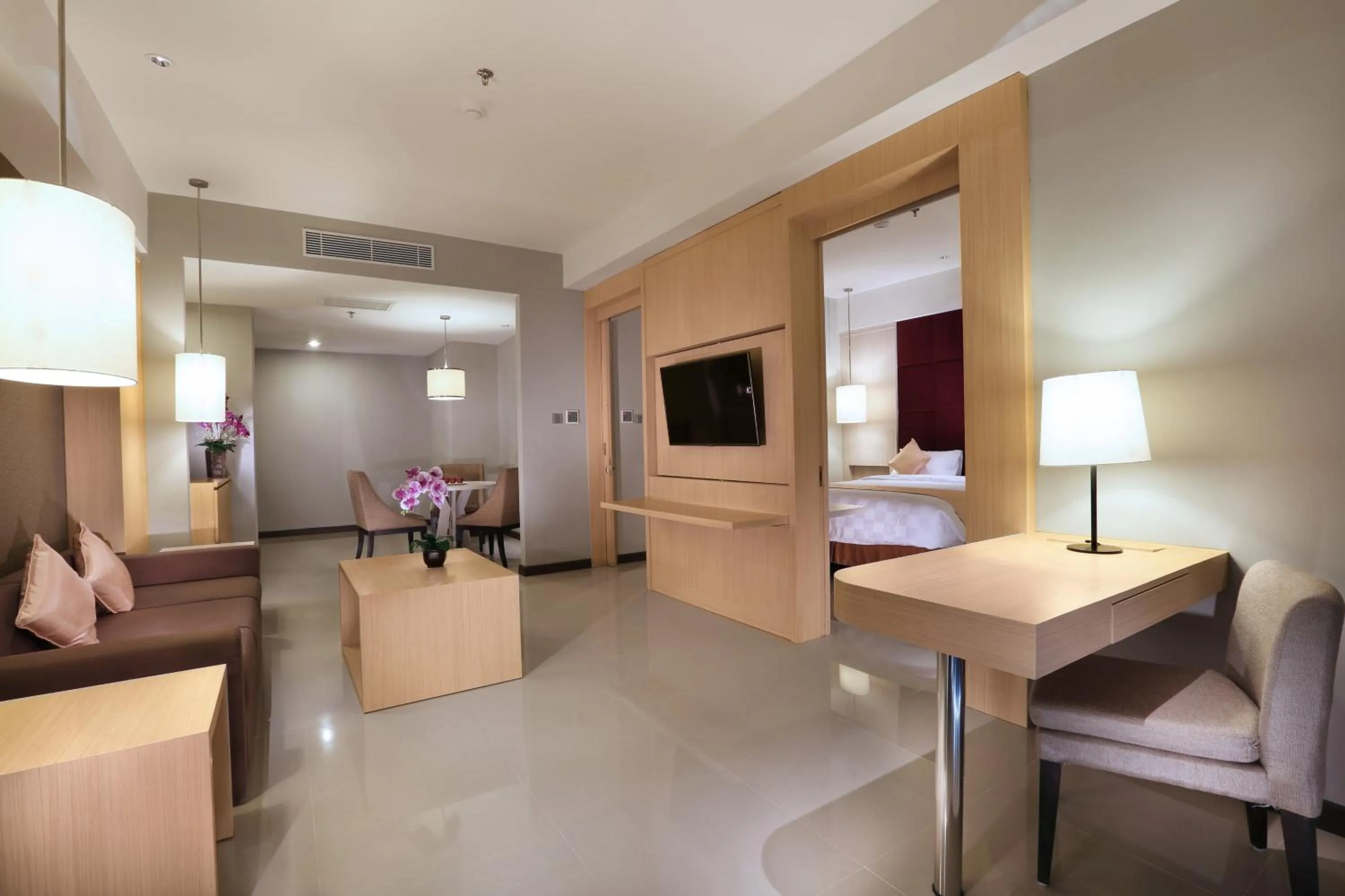 Seating area, Bed in Grand Tan Banjarmasin Hotel & Convention Center