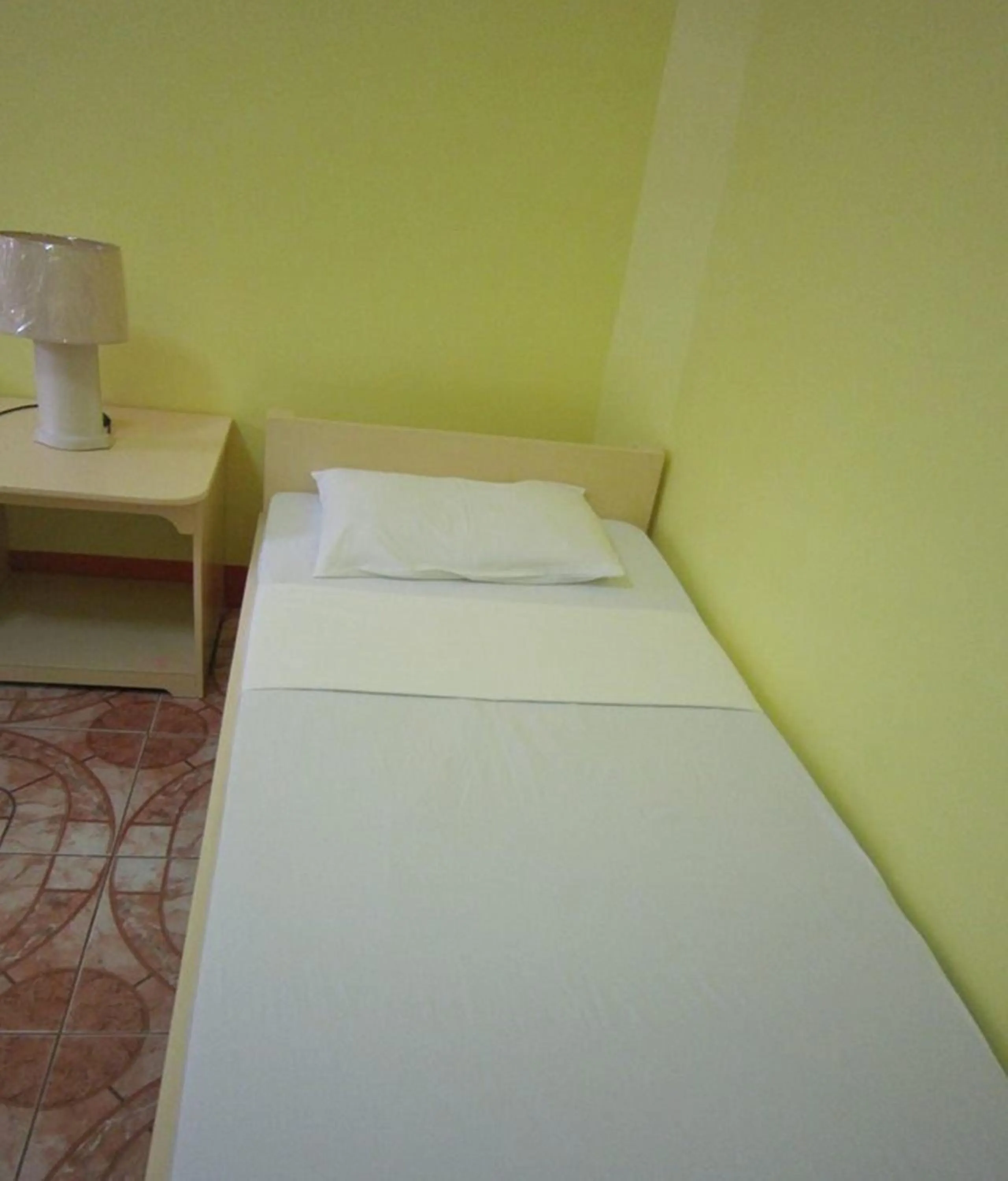 Bed in M&E Guesthouse