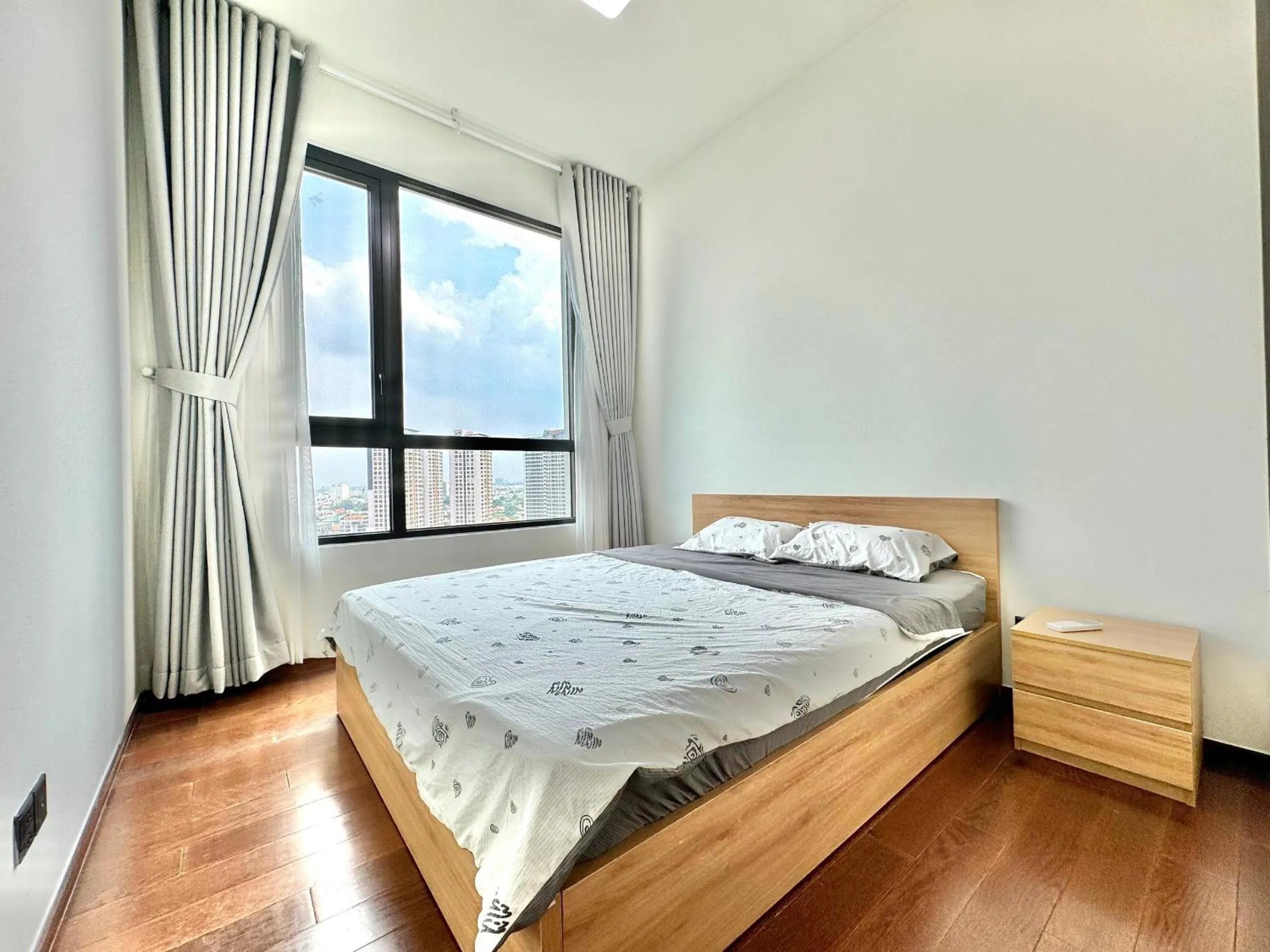 Bed in Homie's Dedge Thao Dien Luxury Apartment