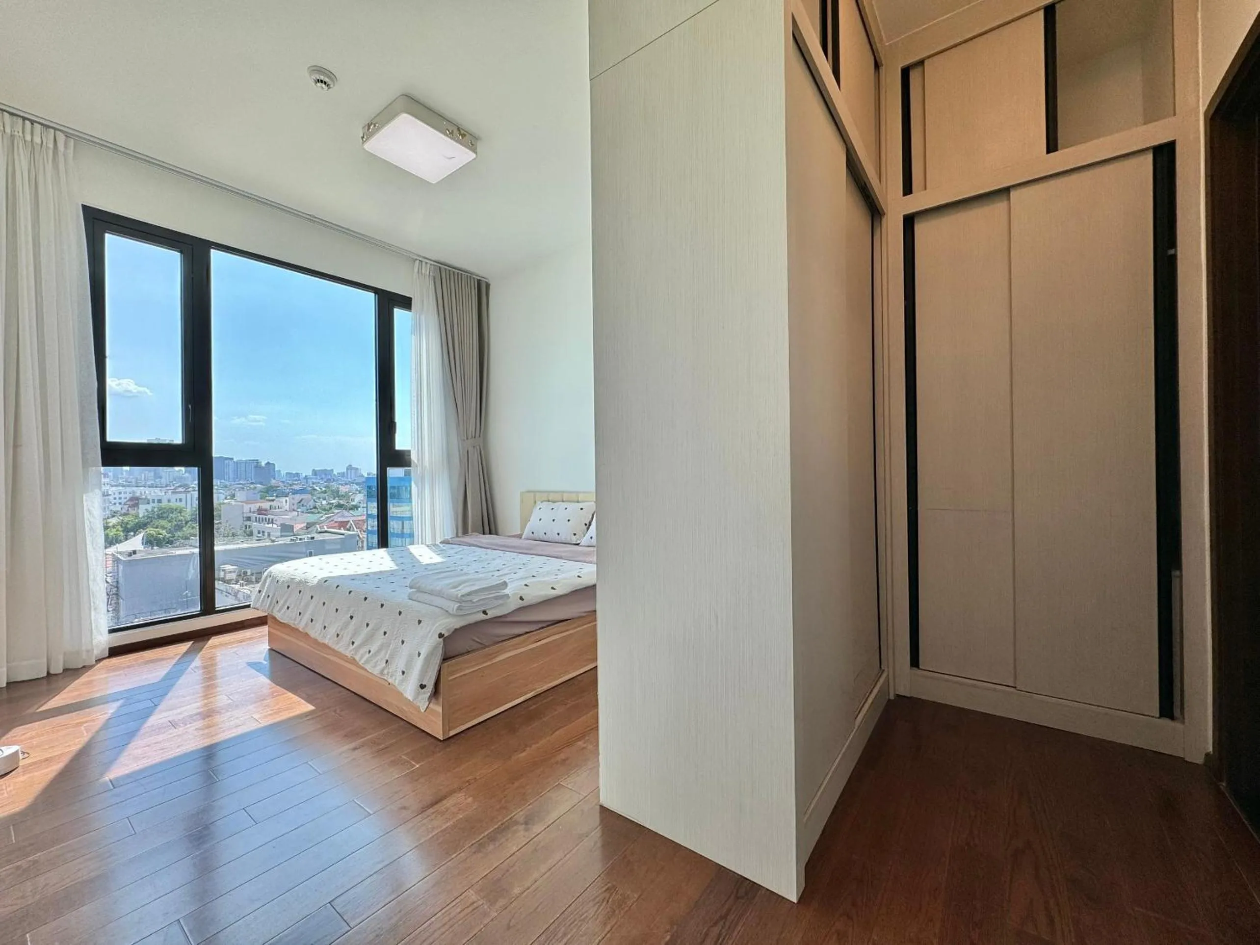 Bed in Homie's Dedge Thao Dien Luxury Apartment