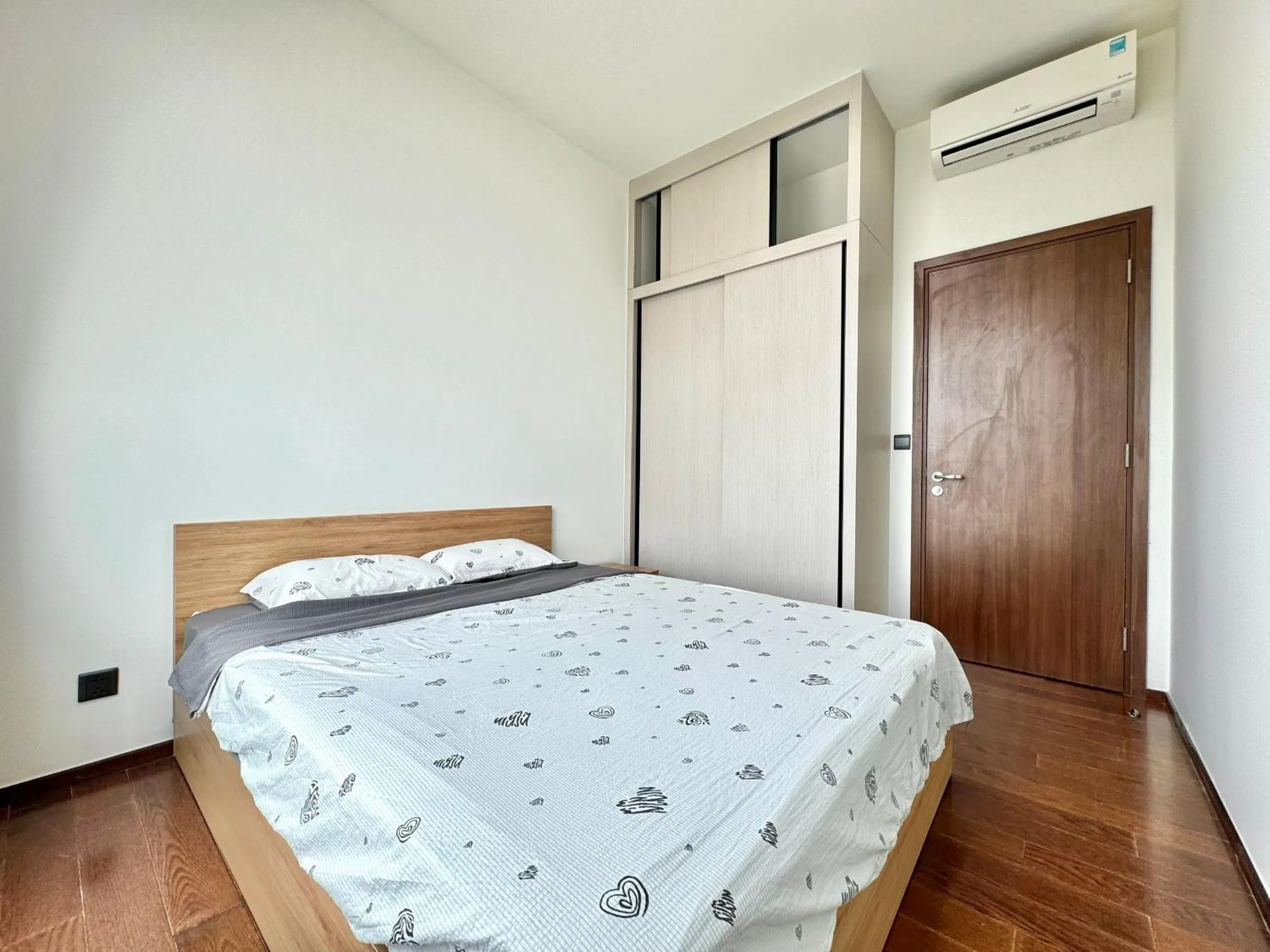 Bed in Homie's Dedge Thao Dien Luxury Apartment