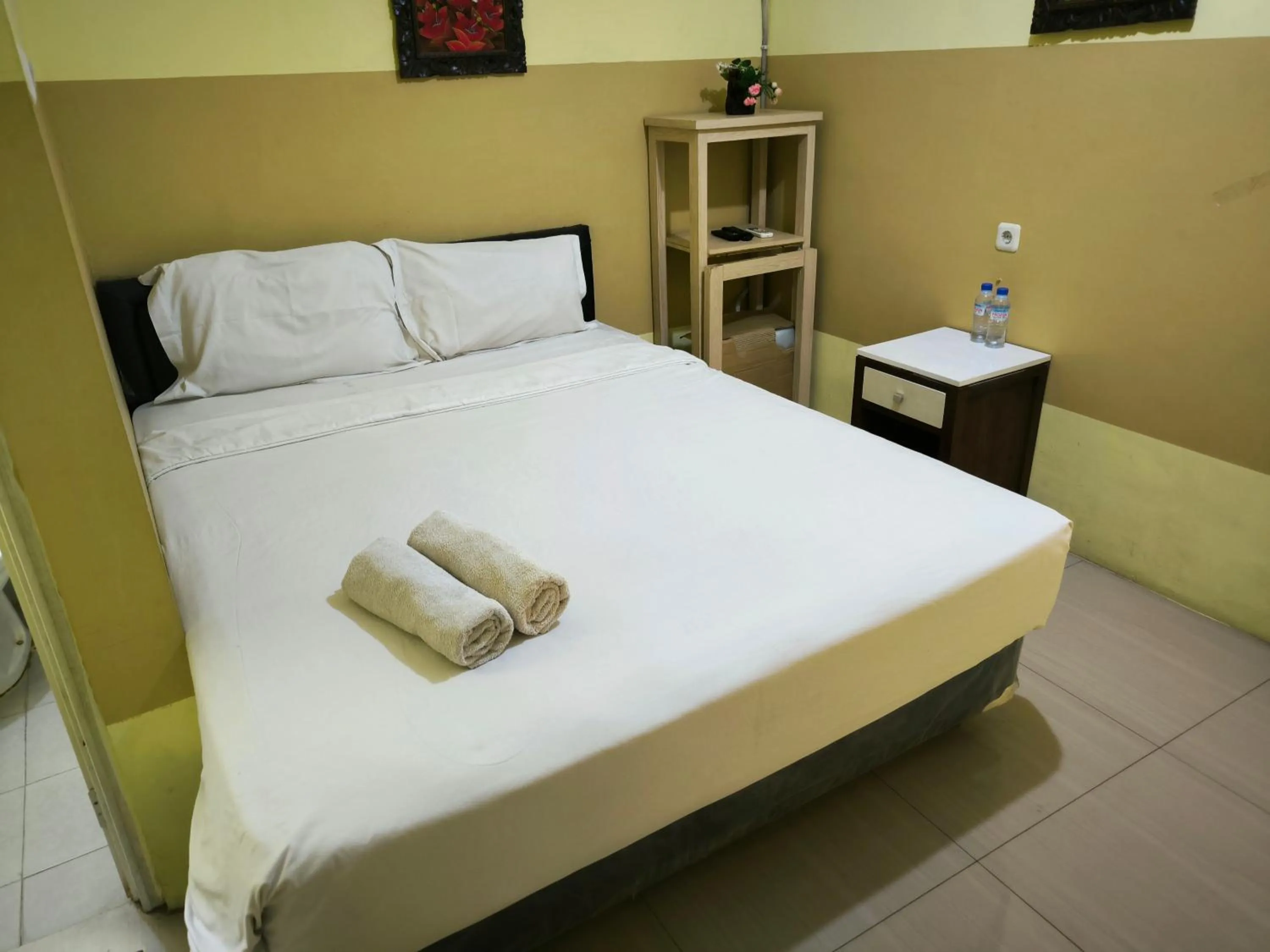 Bed in PROMOSIA GUEST HOUSE