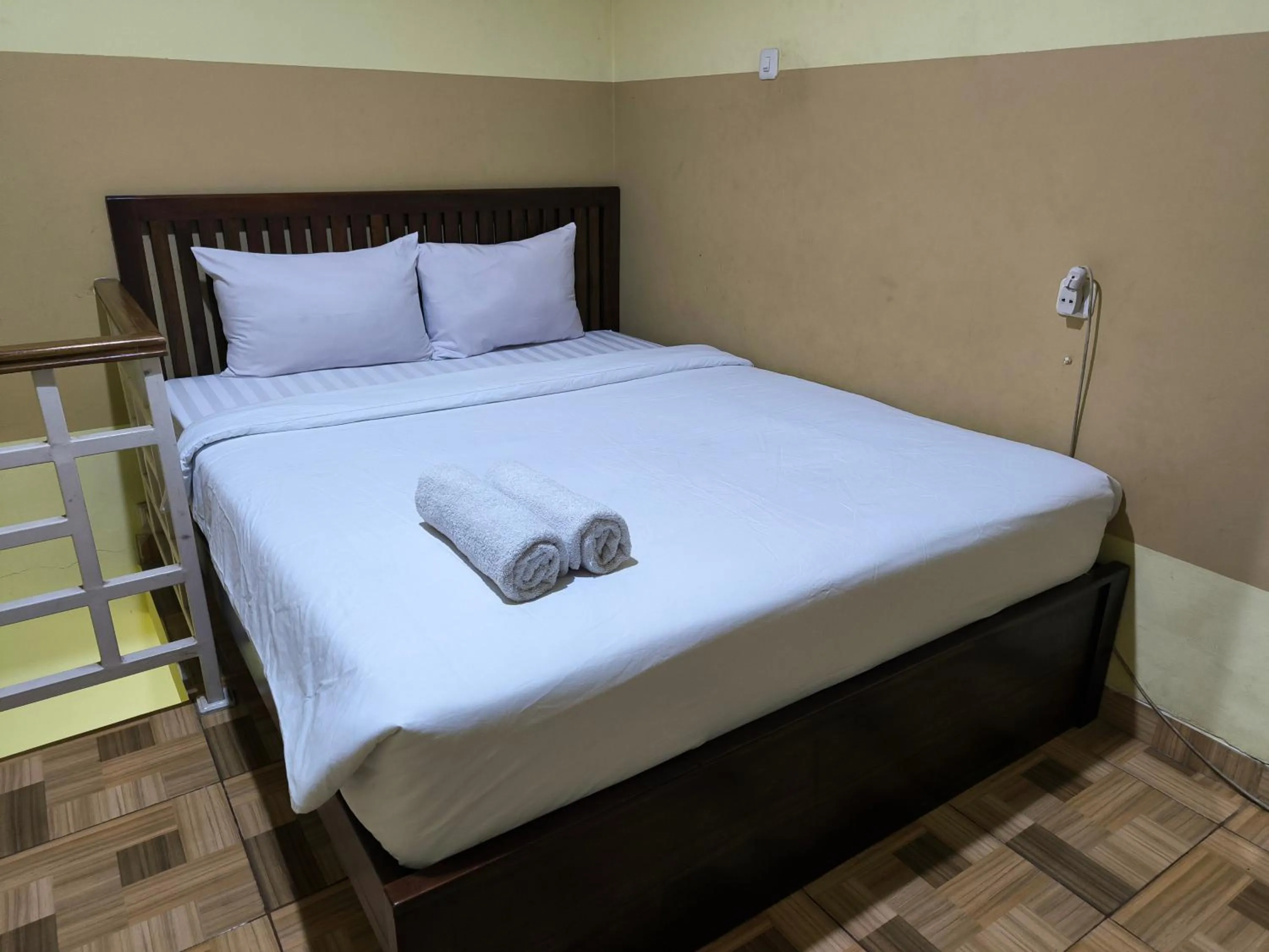 Bed in PROMOSIA GUEST HOUSE