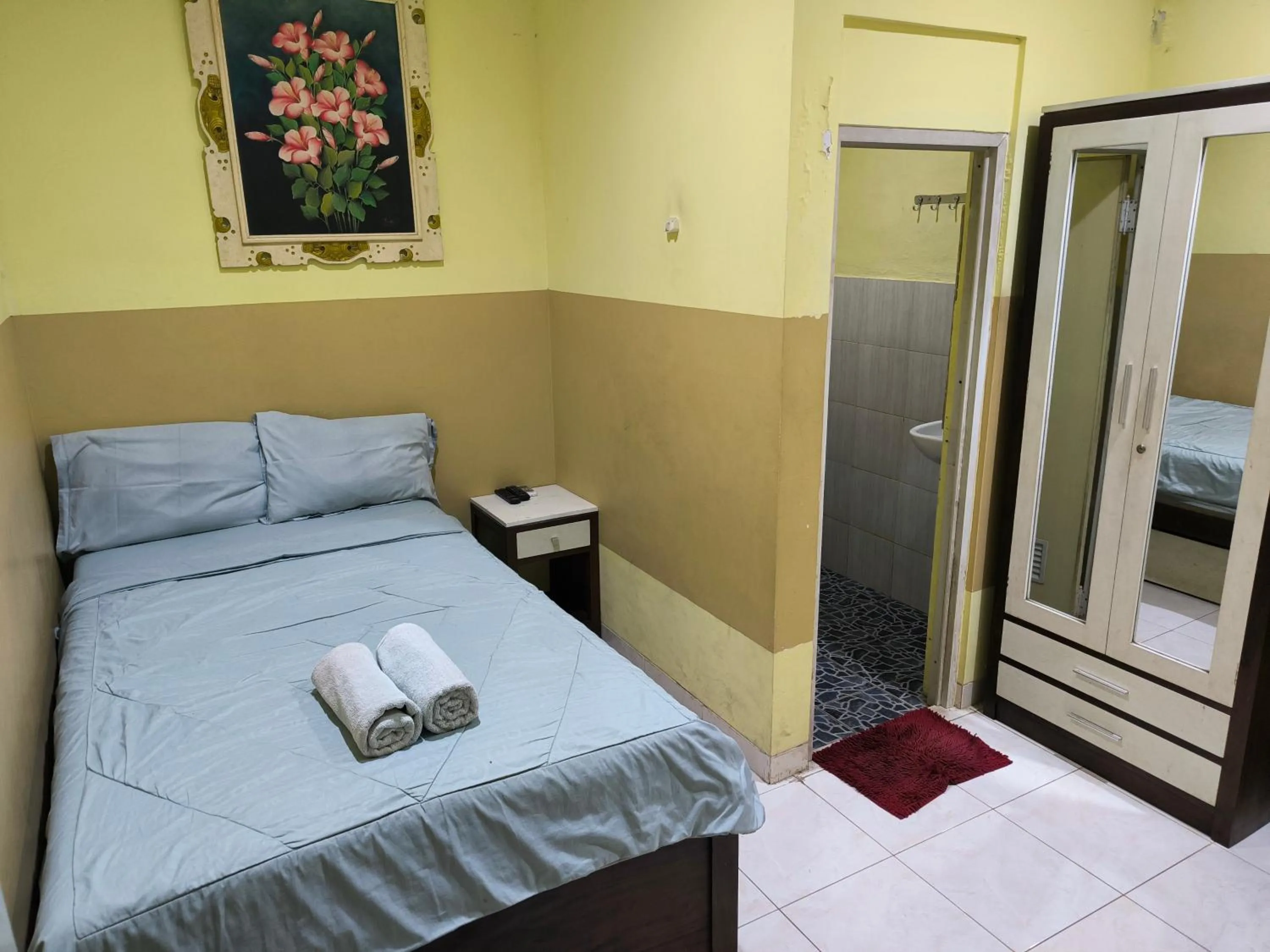 Bed in PROMOSIA GUEST HOUSE