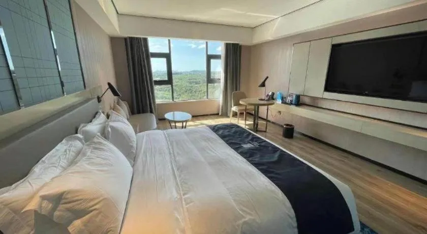 Bed in Echarm Hotel Changjiang Shilu