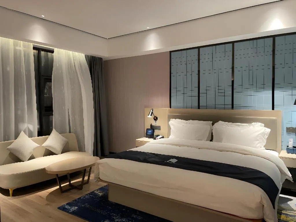 Bed in Echarm Hotel Changjiang Shilu