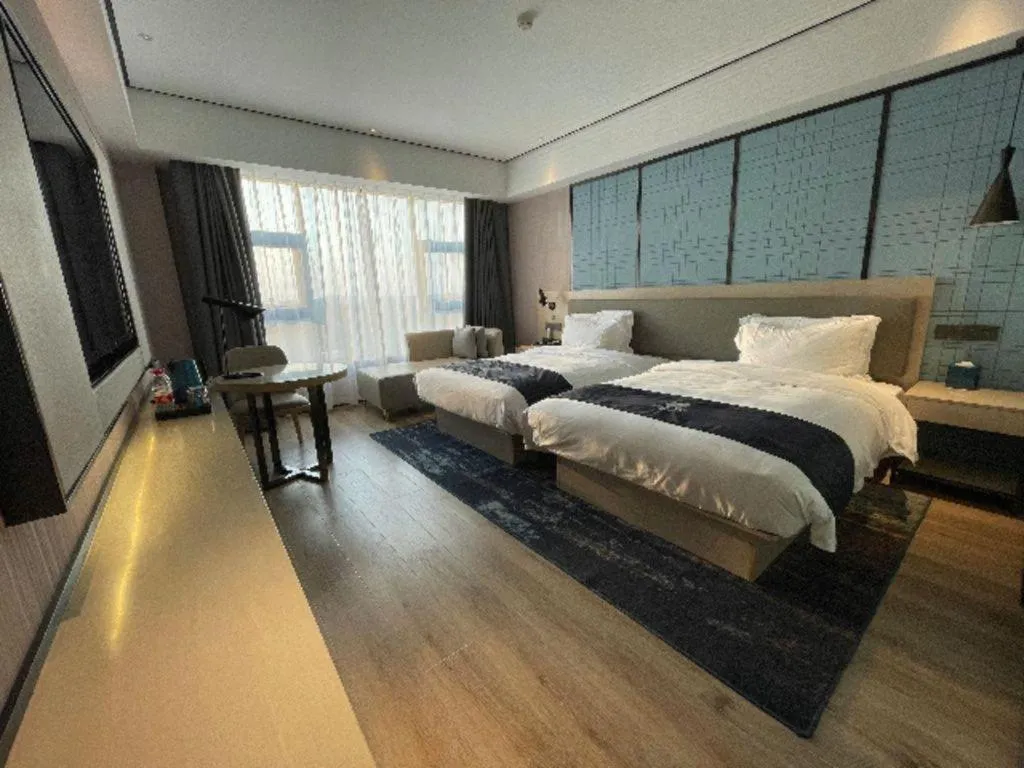 Bed in Echarm Hotel Changjiang Shilu