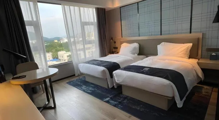 Bed in Echarm Hotel Changjiang Shilu