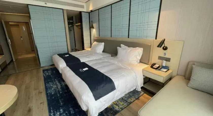 Bed in Echarm Hotel Changjiang Shilu