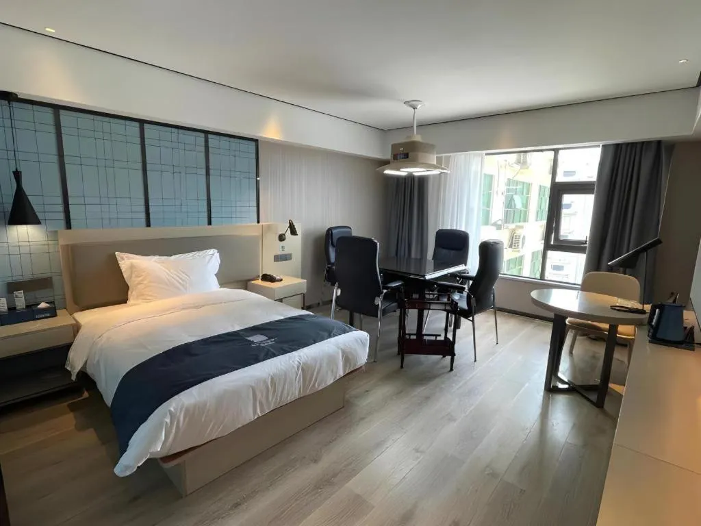 Bed in Echarm Hotel Changjiang Shilu