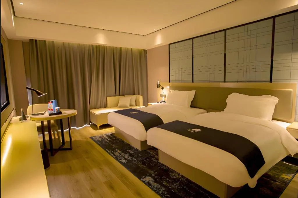 Bed in Echarm Hotel Changjiang Shilu