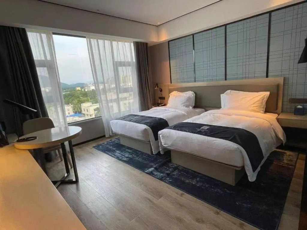 Bed in Echarm Hotel Changjiang Shilu