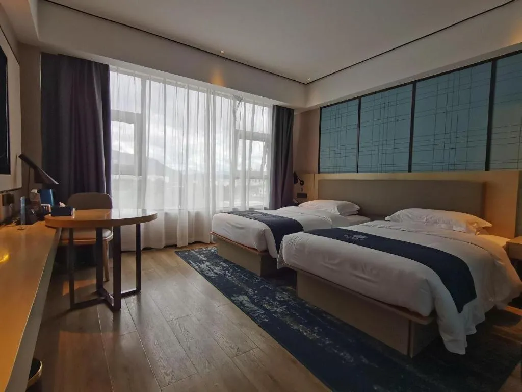 Bed in Echarm Hotel Changjiang Shilu