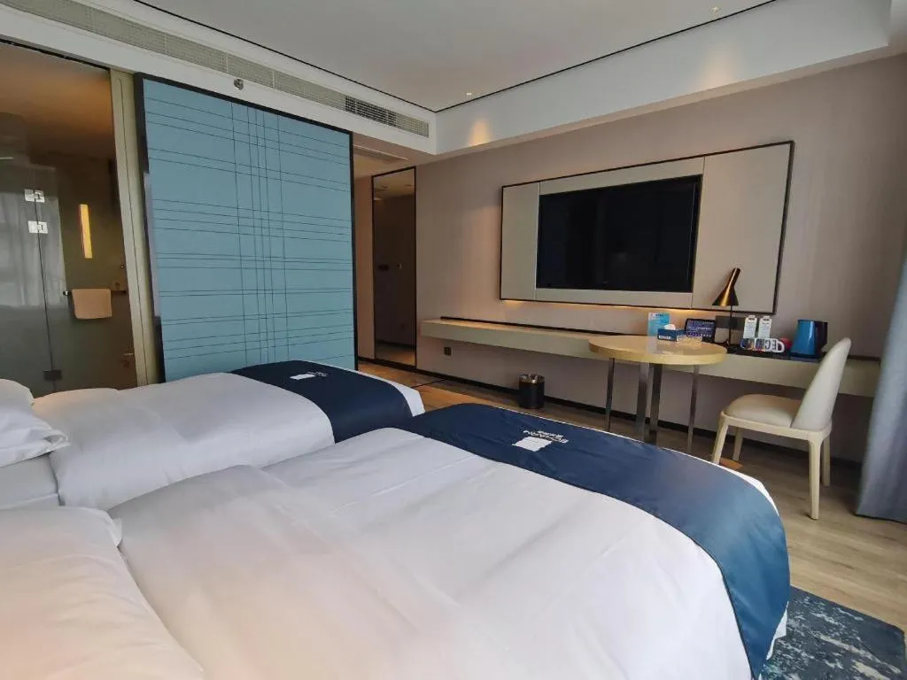 Bed in Echarm Hotel Changjiang Shilu